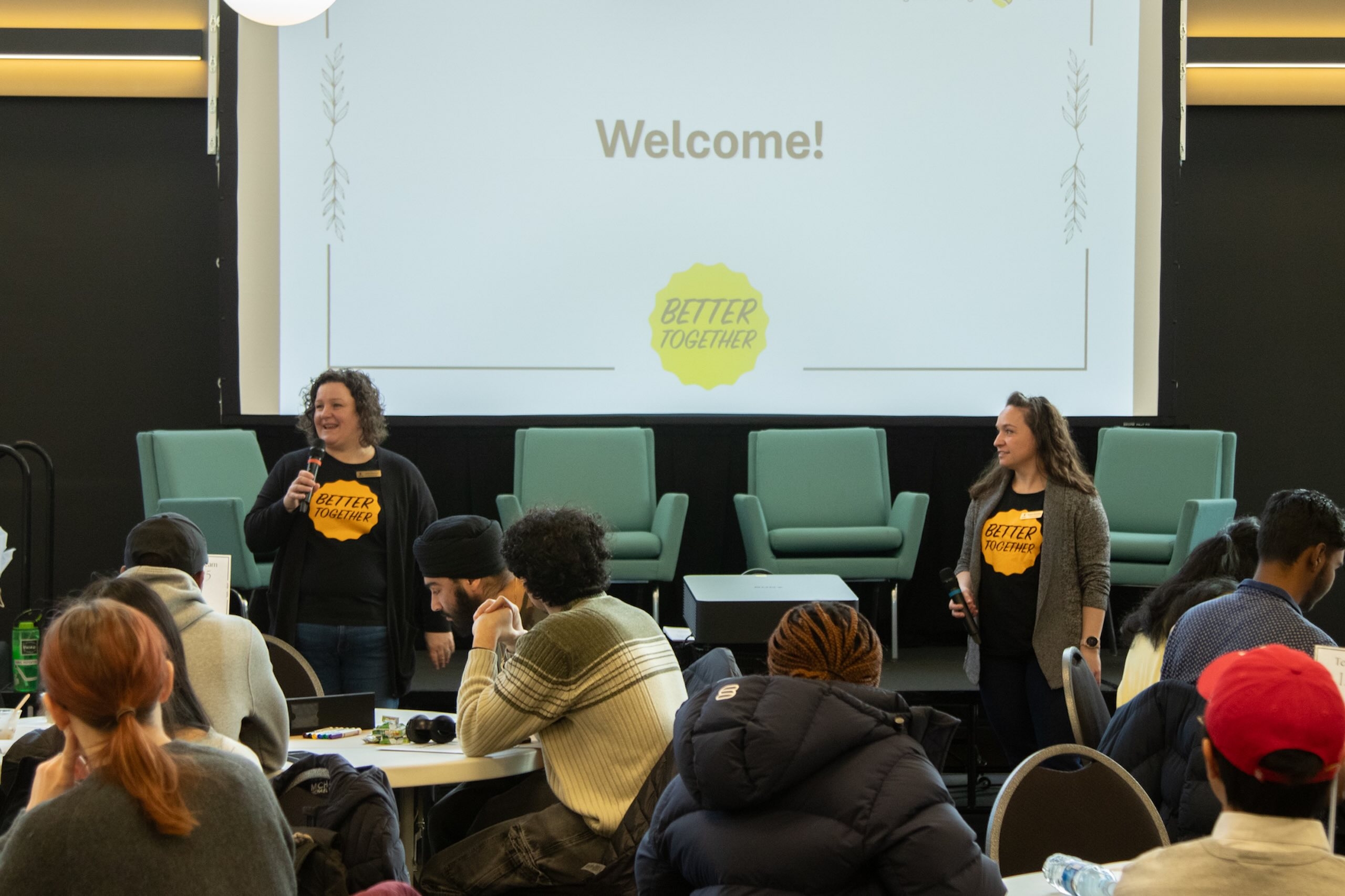 Janine Carmichael and Meaghan Ewharekuko welcome participants to the 2026 Better Together event.