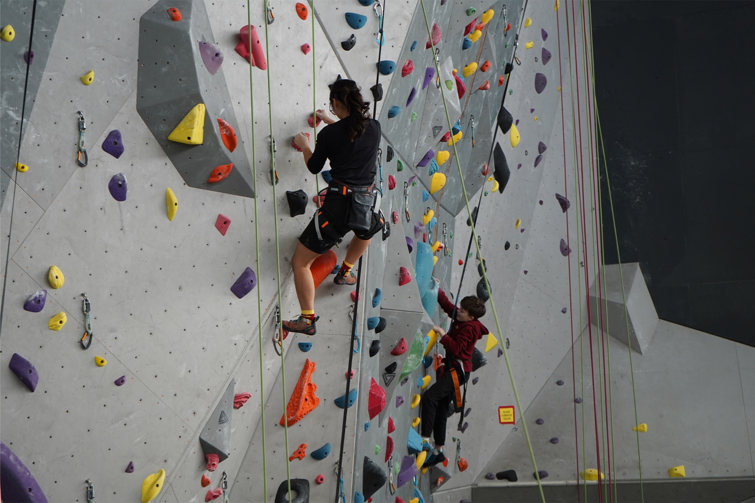 Two climbers on the wall during competition in the Big Wall Classic