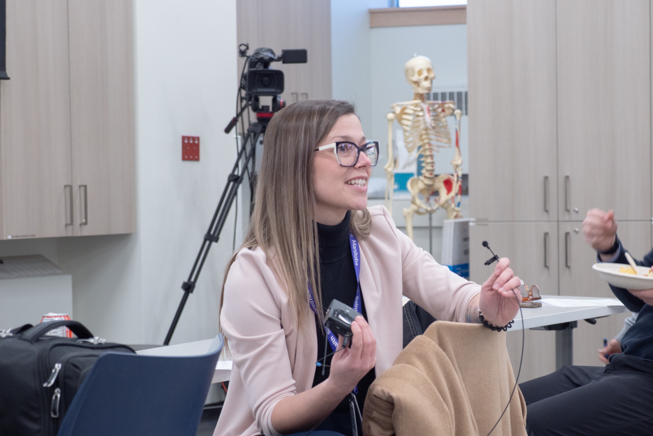 A person talking at a meeting.