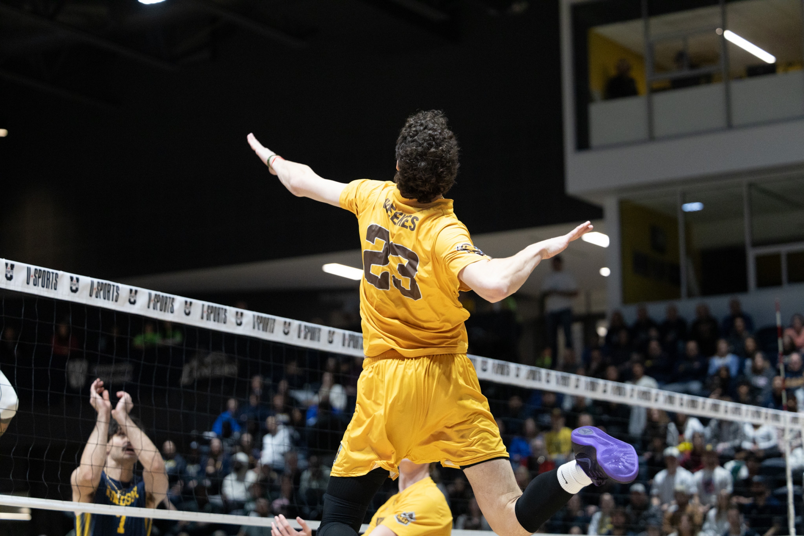 Owen weeks mid air during an attack in a volleyball game