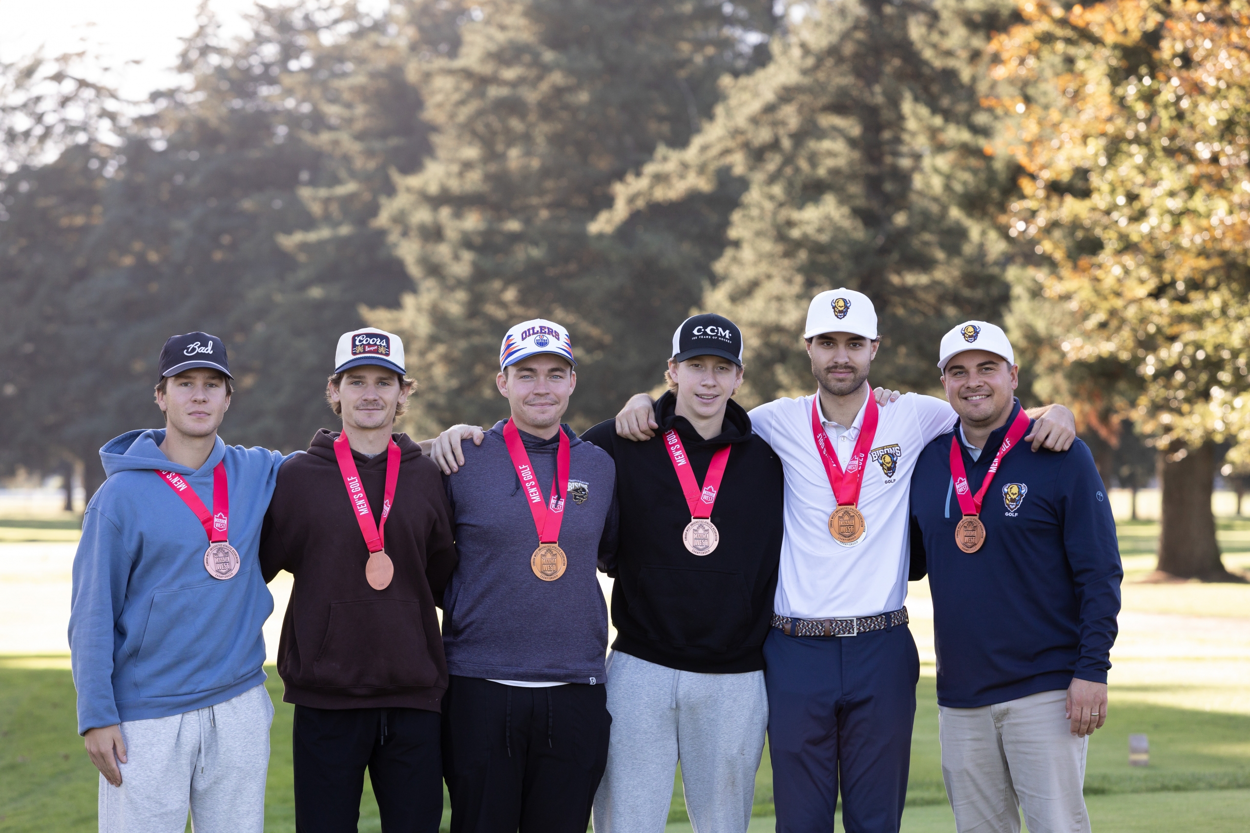 The Bisons golf team posing with their medals