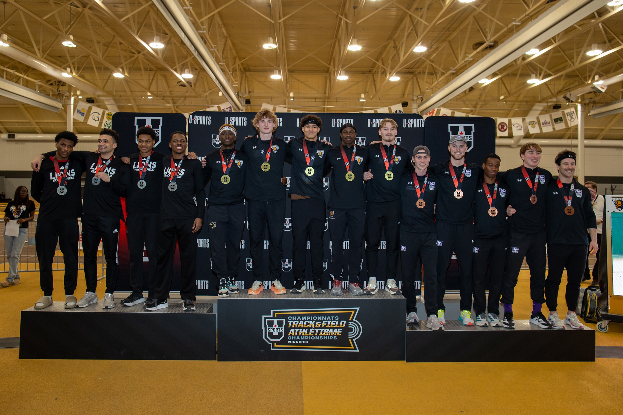 The Bisons men's 4x200m relay team on the podium