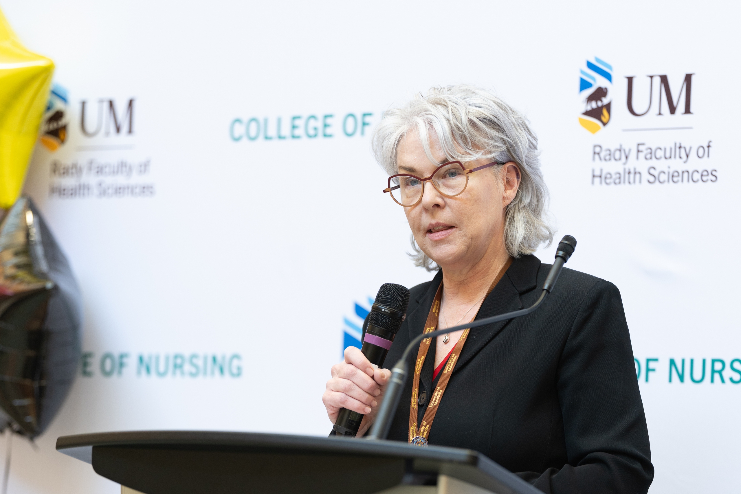 College of Nursing dean Dr. Kellie Thiessen speaks at a podium. 