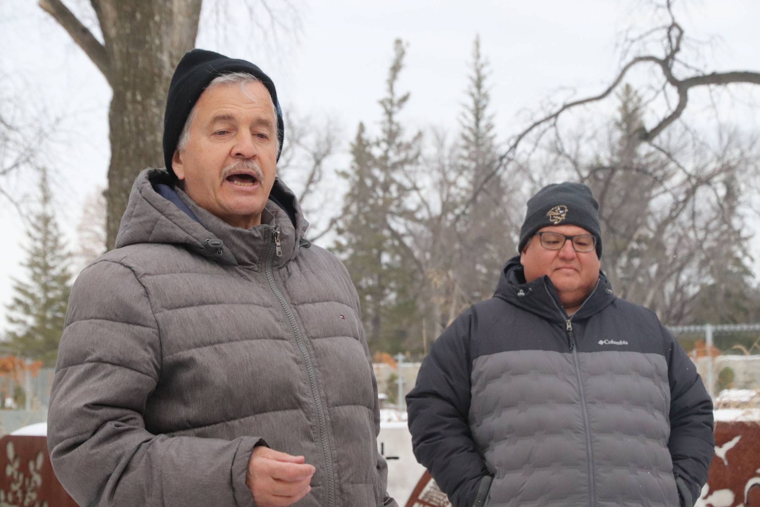 Dr. Brian Rice speaking beside Dr. Dan Henhawk during an outdoor education class