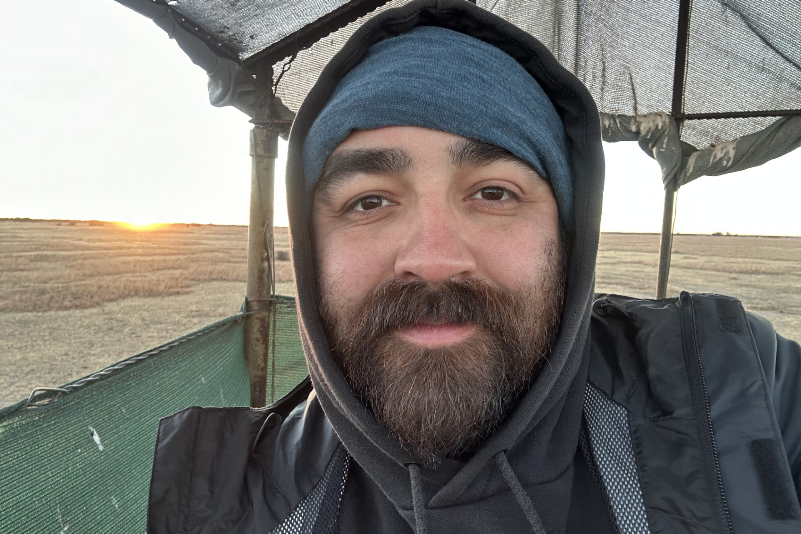 Close-up of a smiling man with a beard