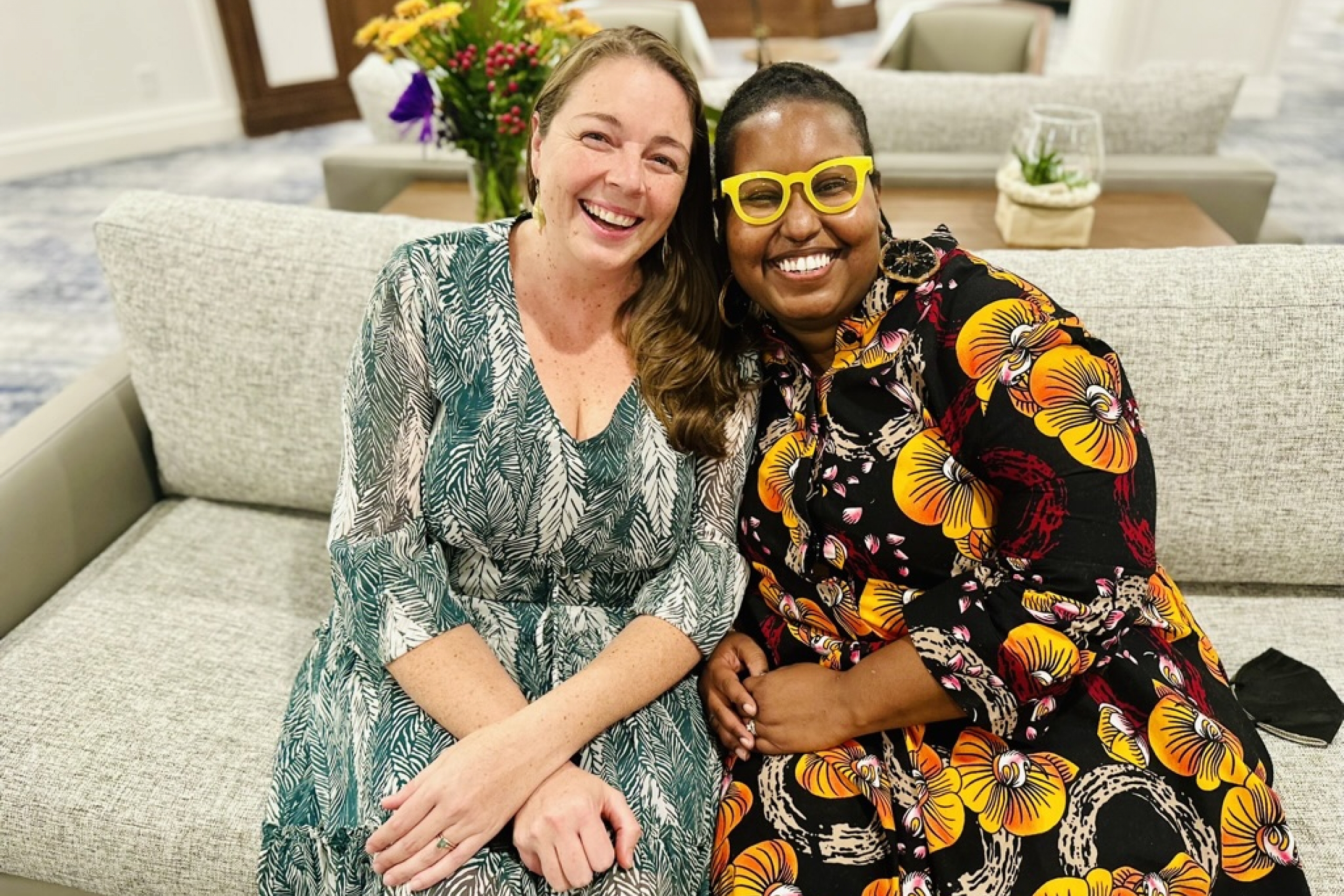 Christine and Britton sit together on sofa before awards ceremony