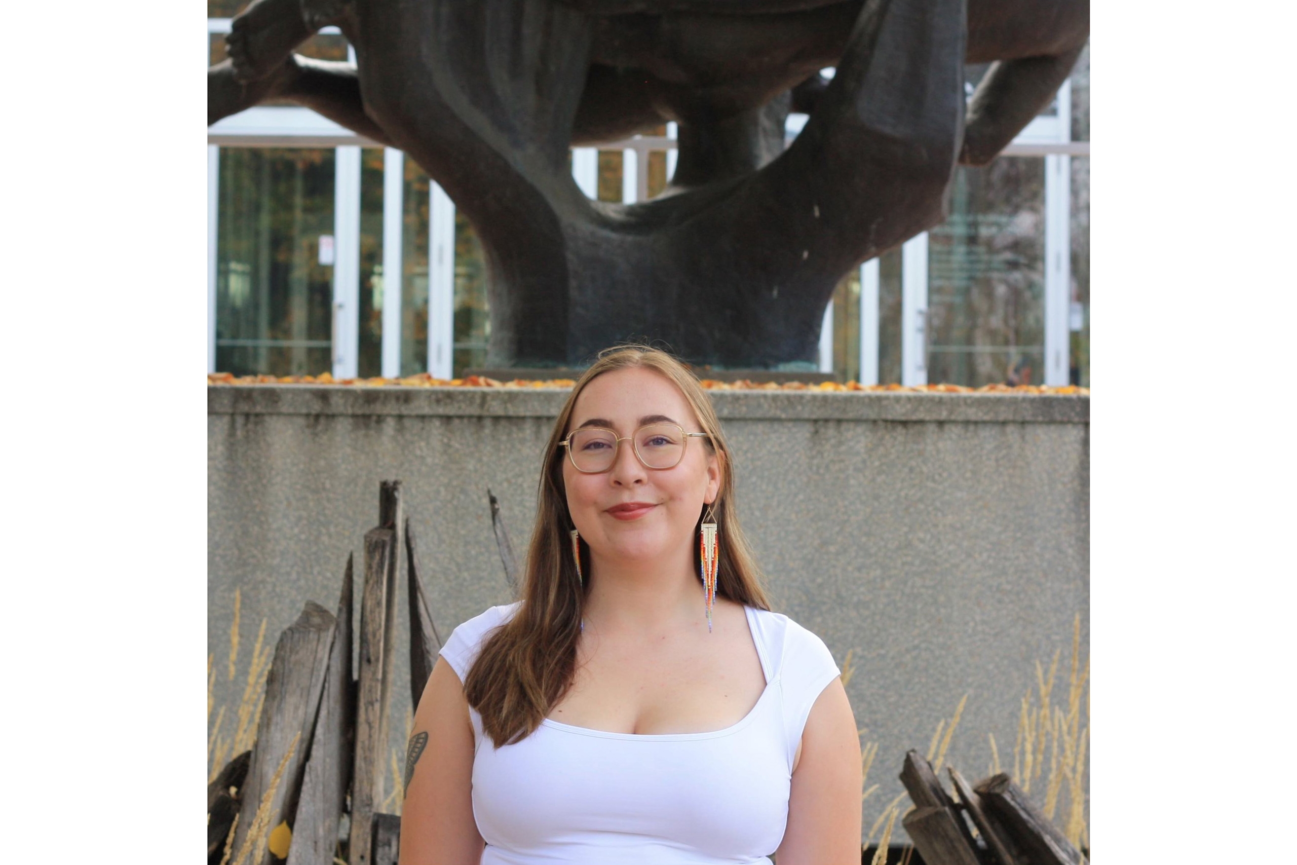 Jory in front of the architecture building and statue on the pedway.