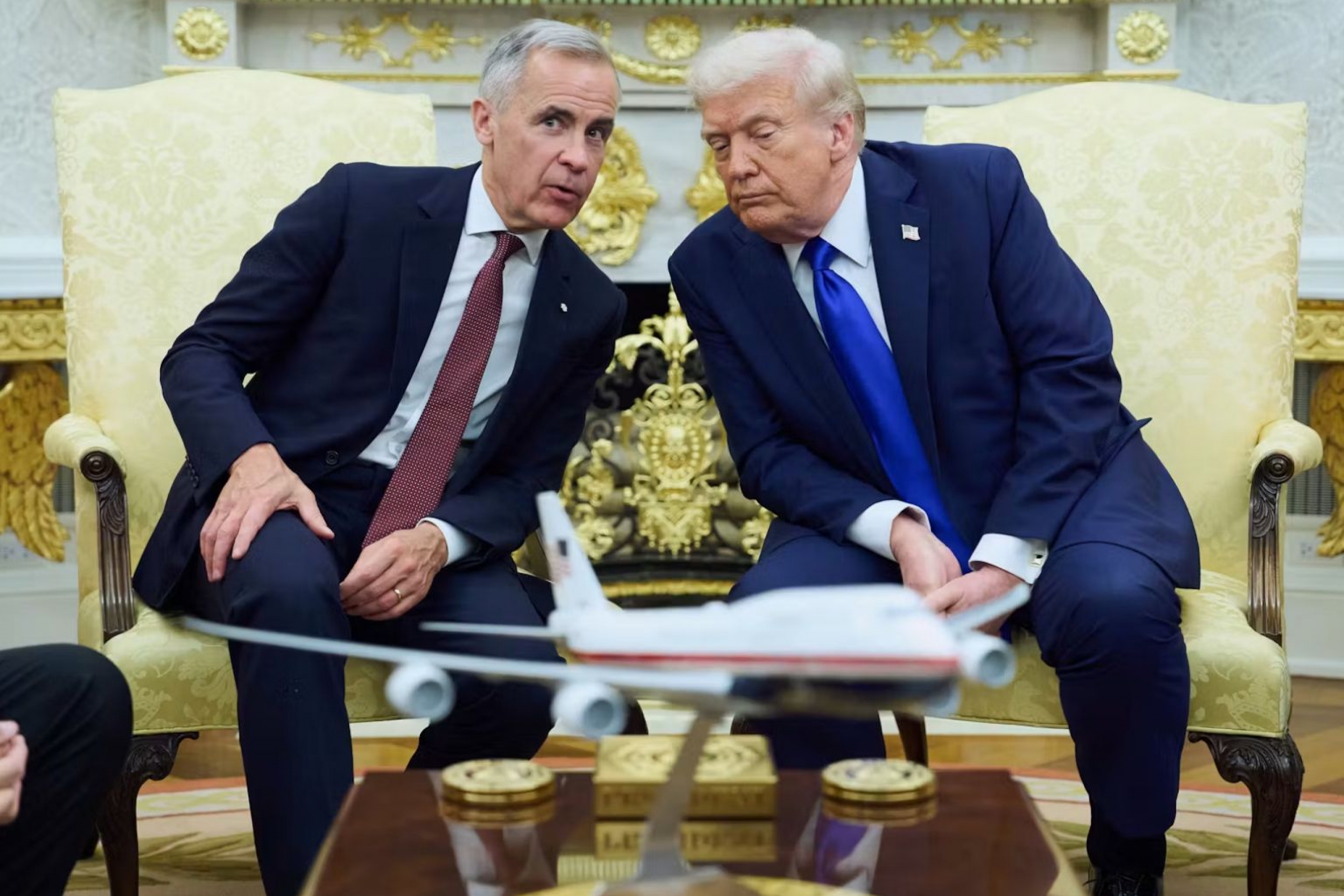 Carney and Trump sitting beside each other