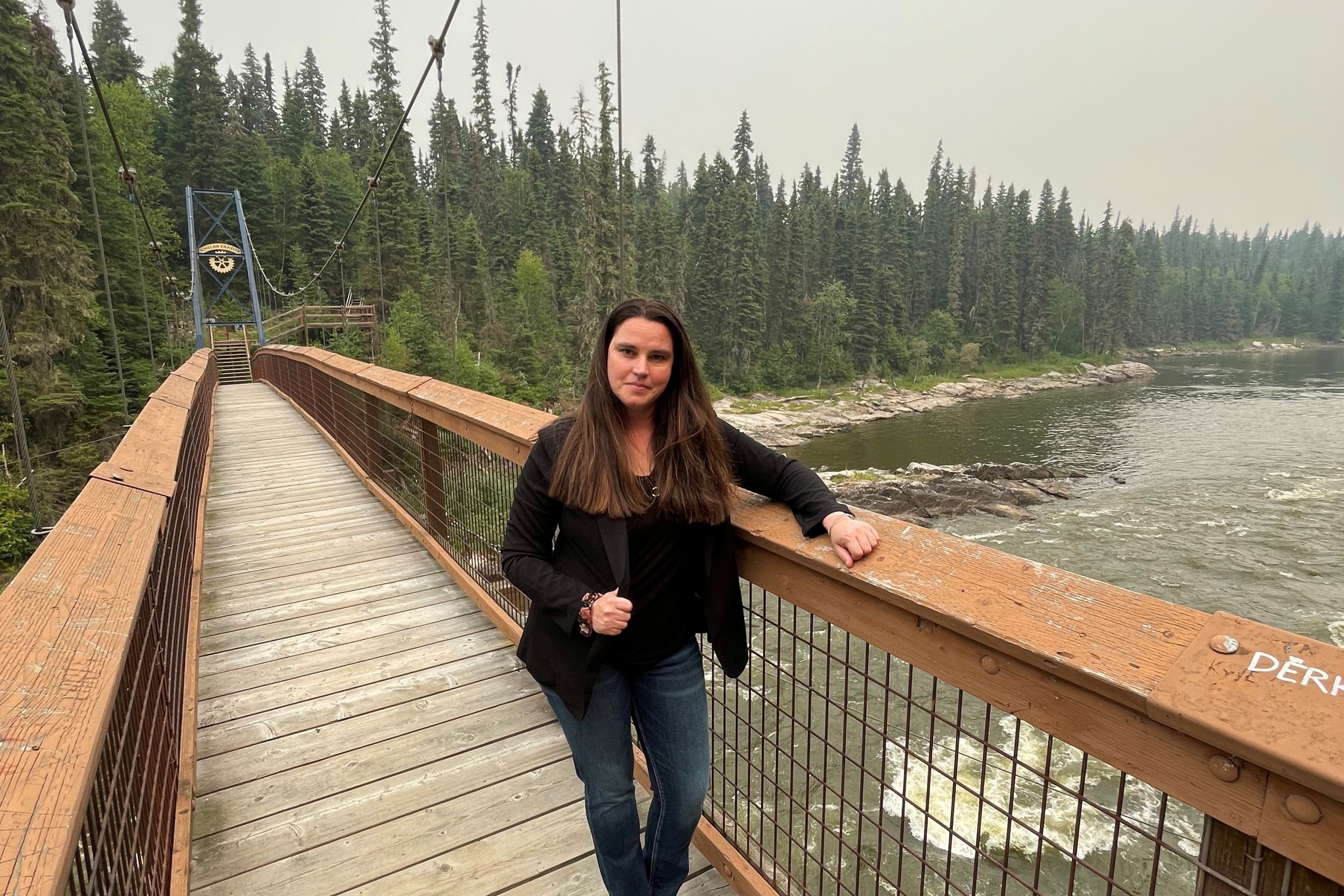 Cherie Murie stands on the Rotary Bridge near Pisew Falls.