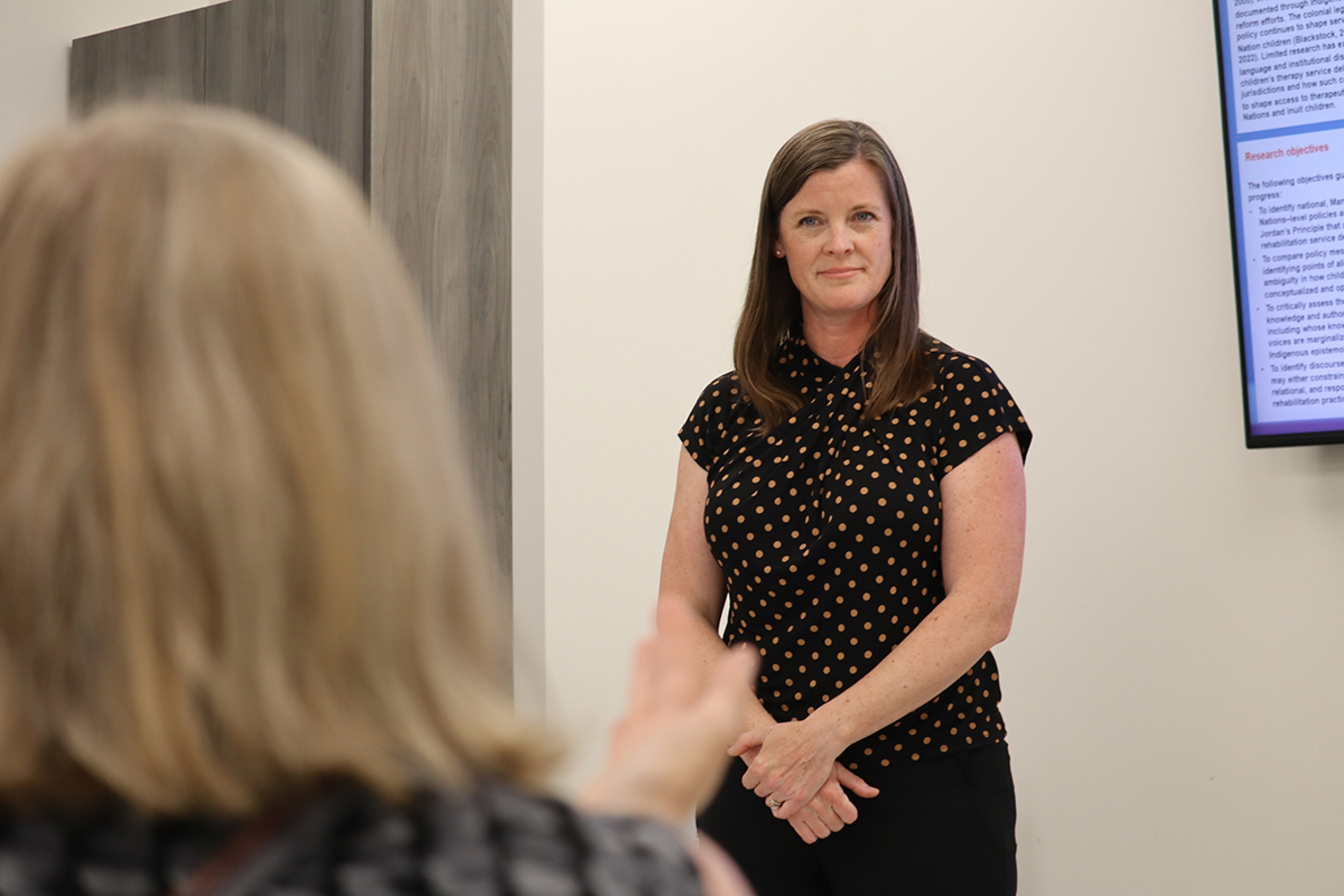 Christy Hemmerling answers questions during her research presentation.