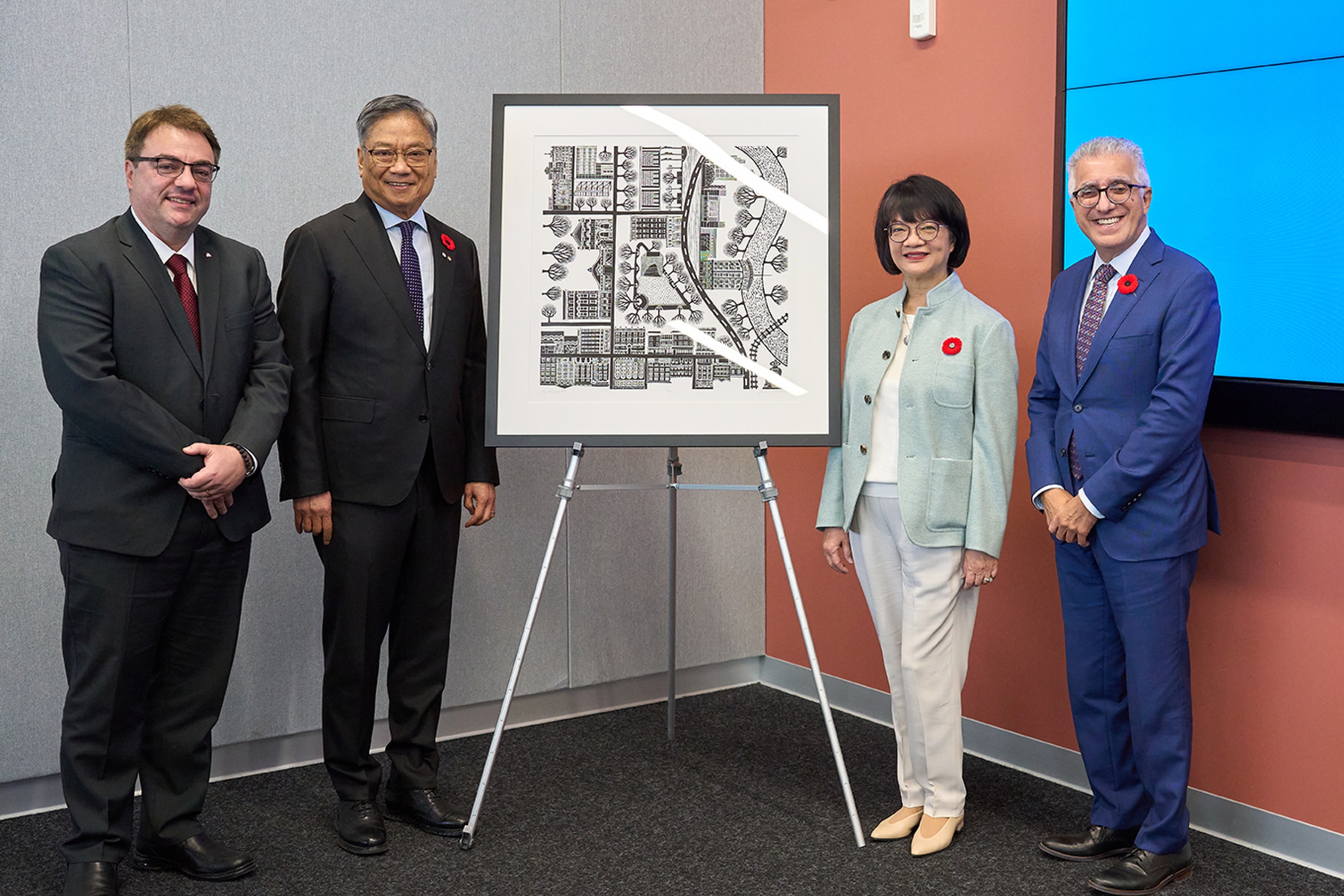 Bruno Silvestre, Wayne Chiu, Eleanor Chiu, Michael Benarroch standing beside an artist's print