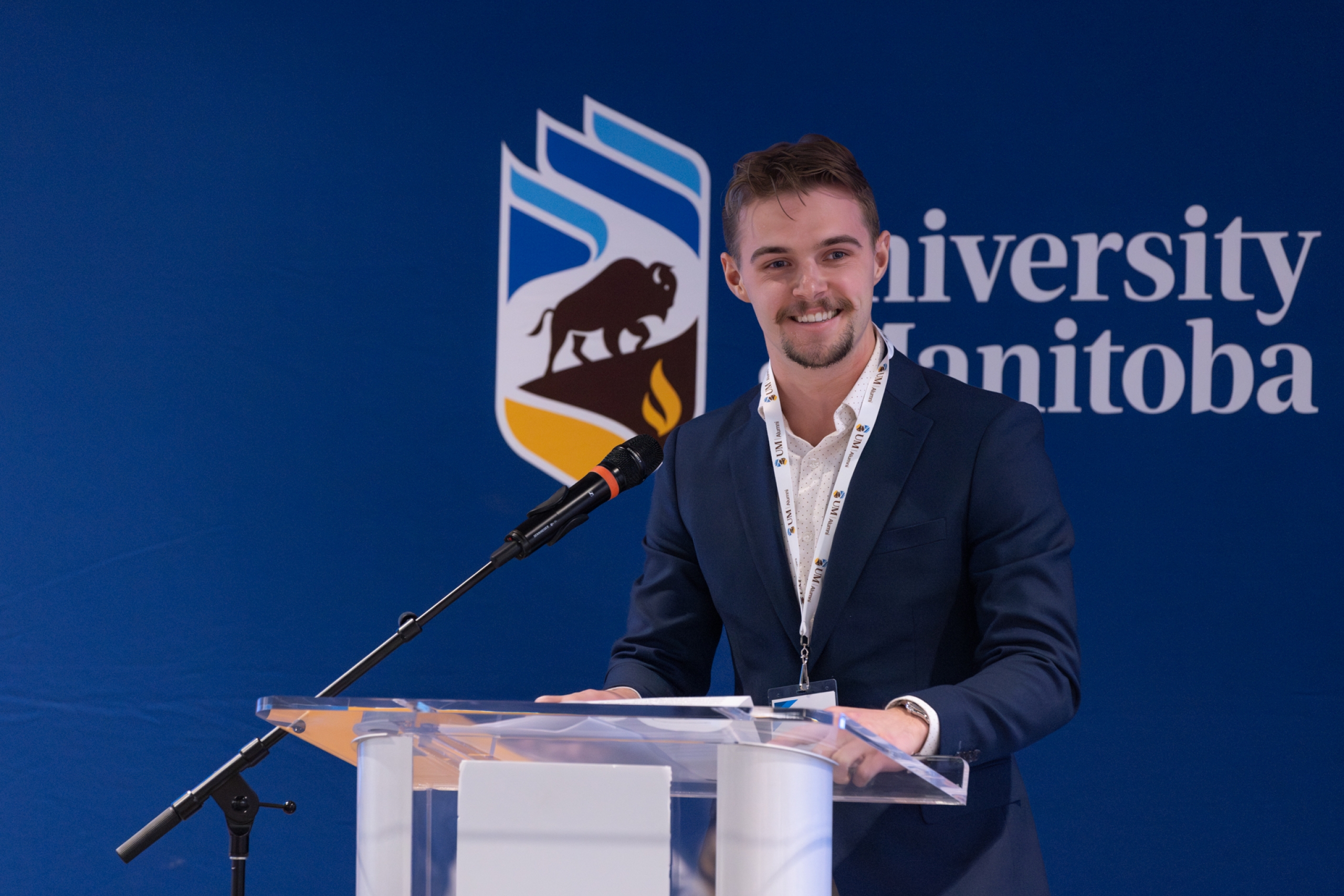 Alex Witt speaking at a podium