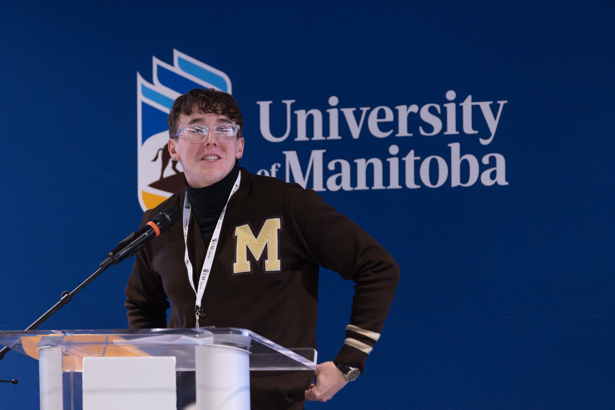 Carson Beggs speaking at a podium