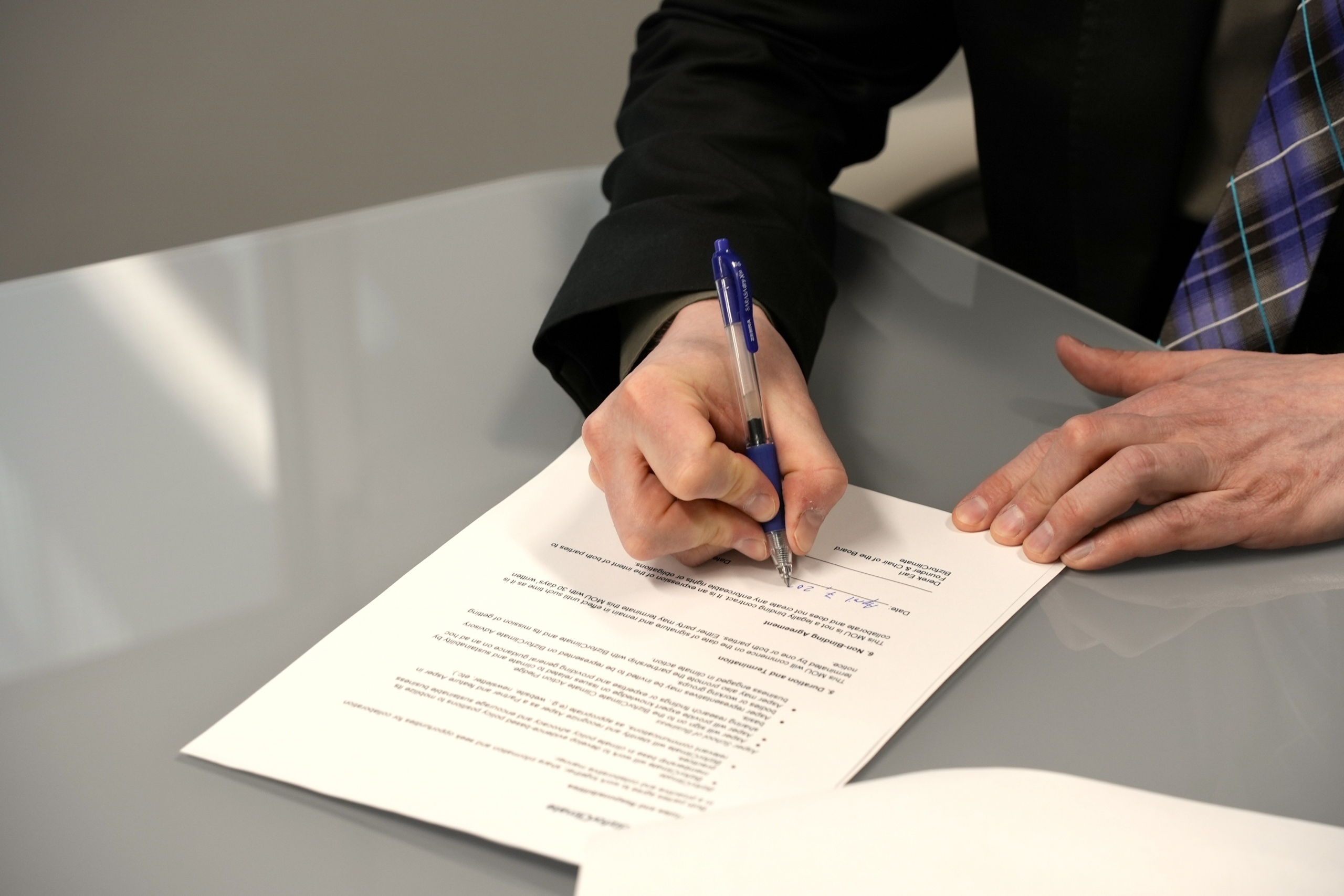 Derek Earl signing the MoU