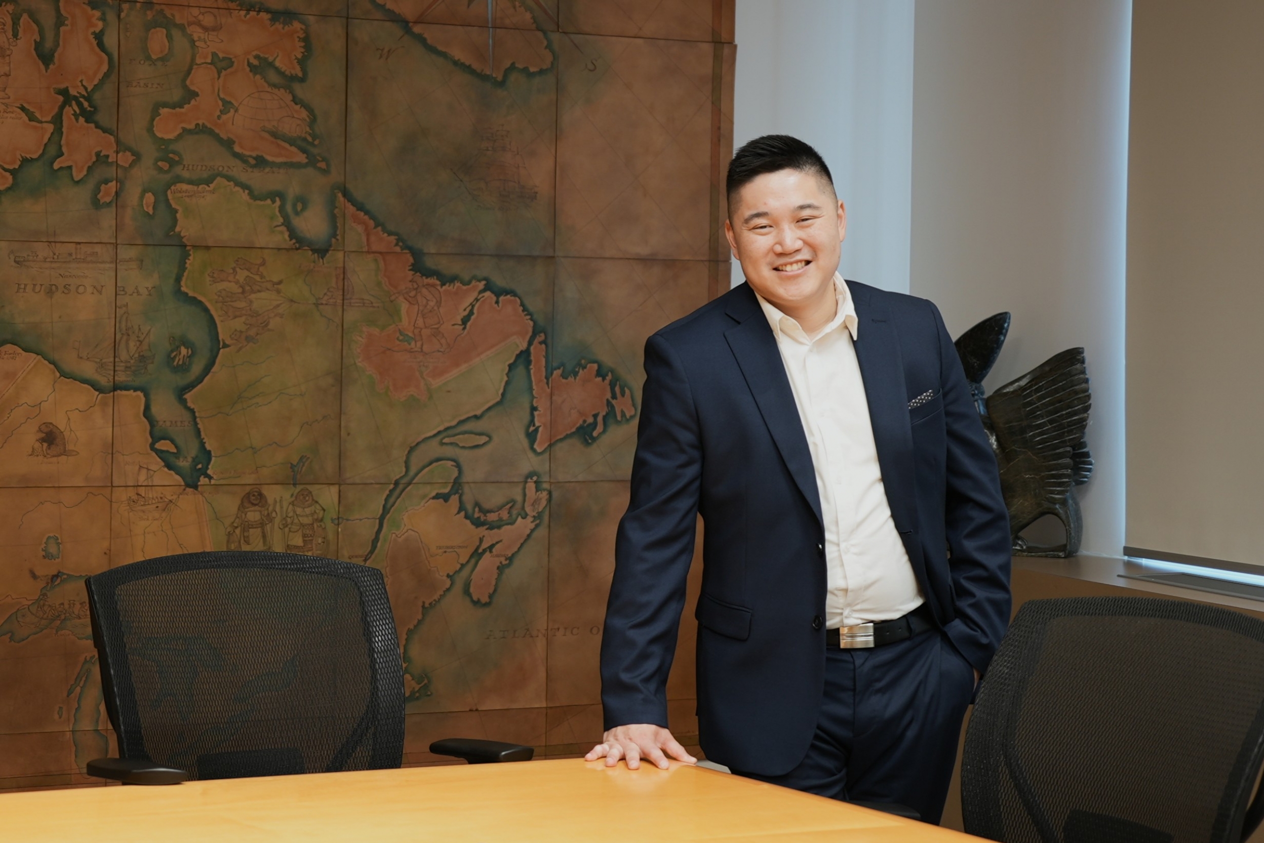 Clinton Lim in a boardroom