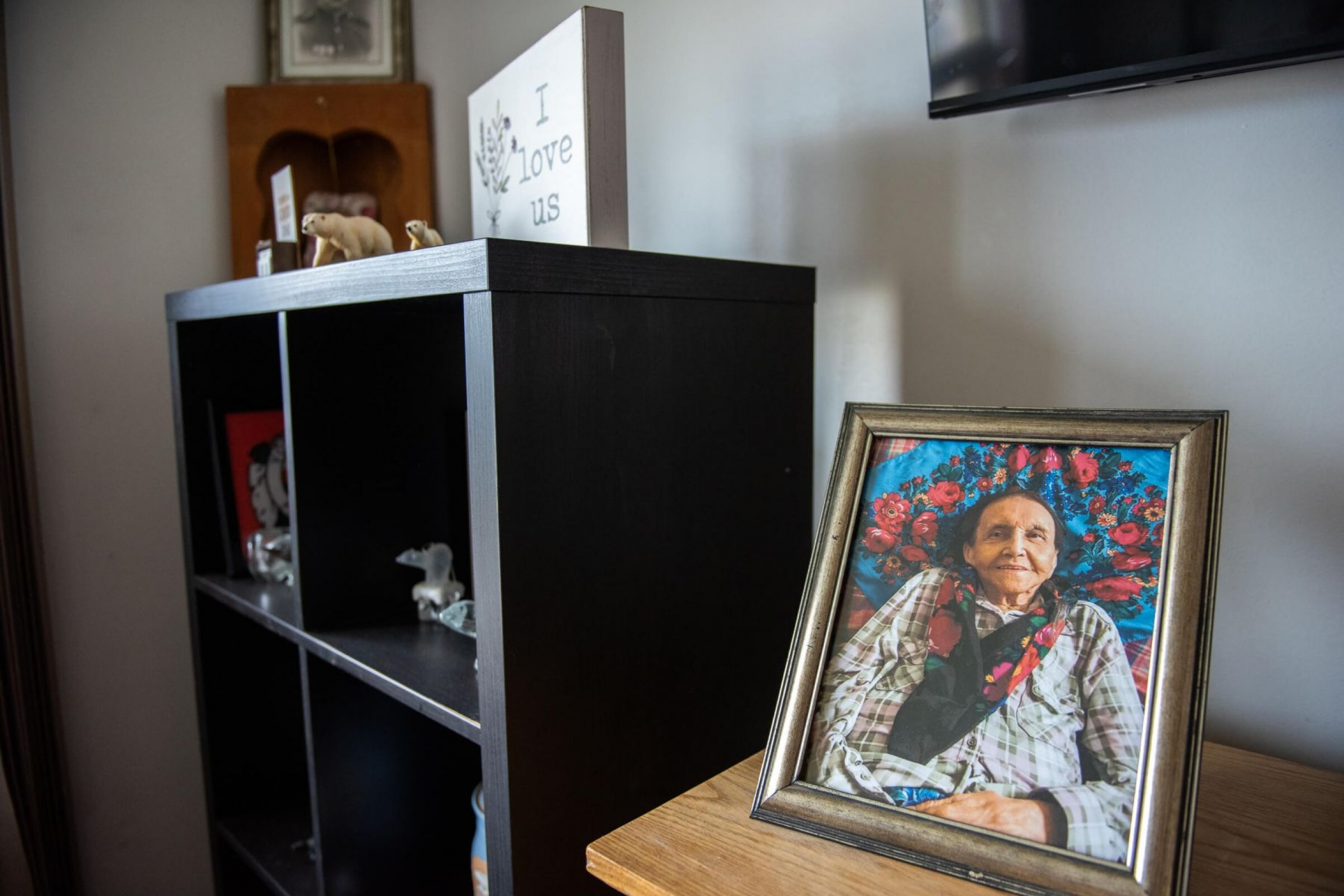 A photo of a woman in a frame.