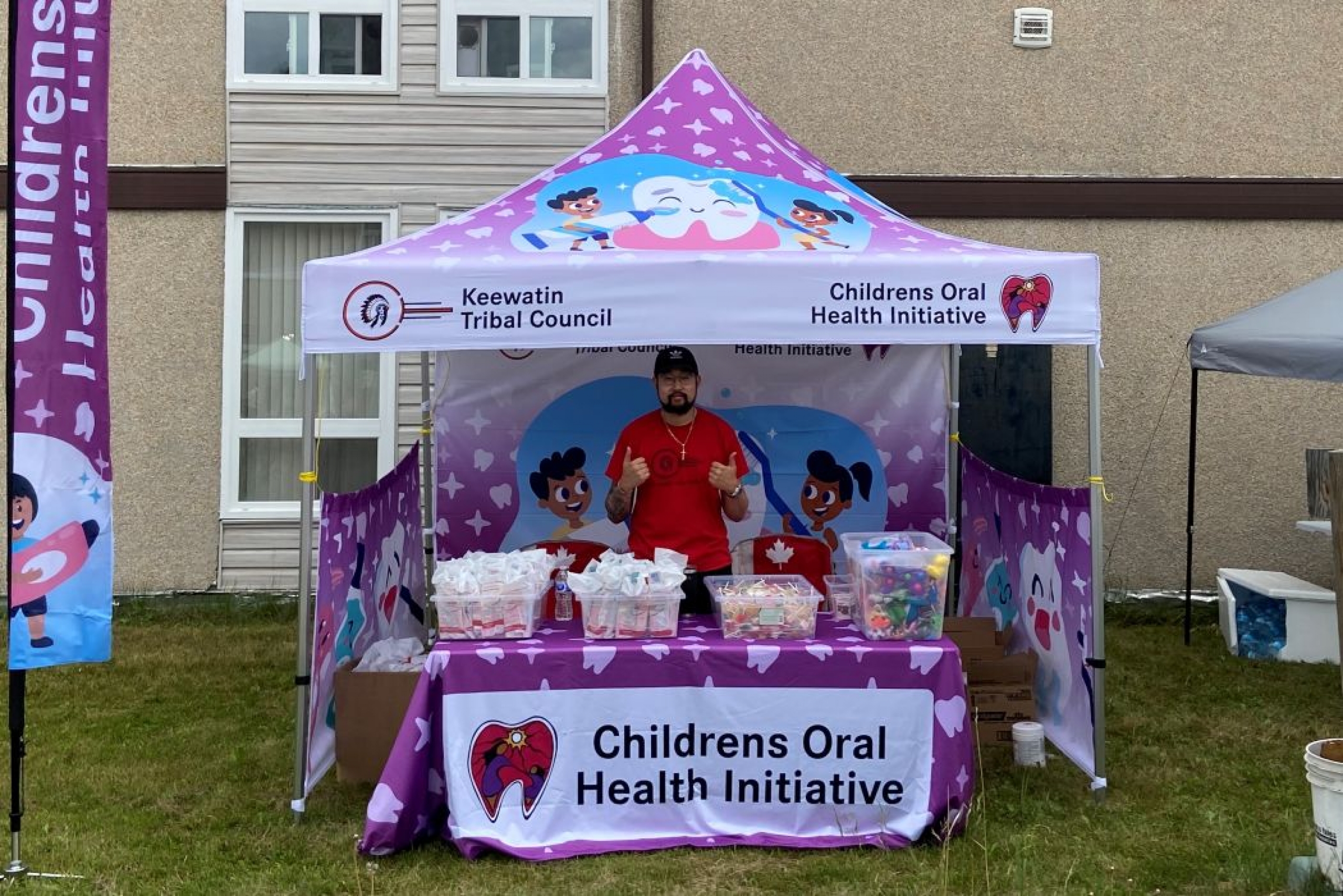 David Van stands beneath the Keewatin Tribal Council Childrens Oral Health Initiative tent.