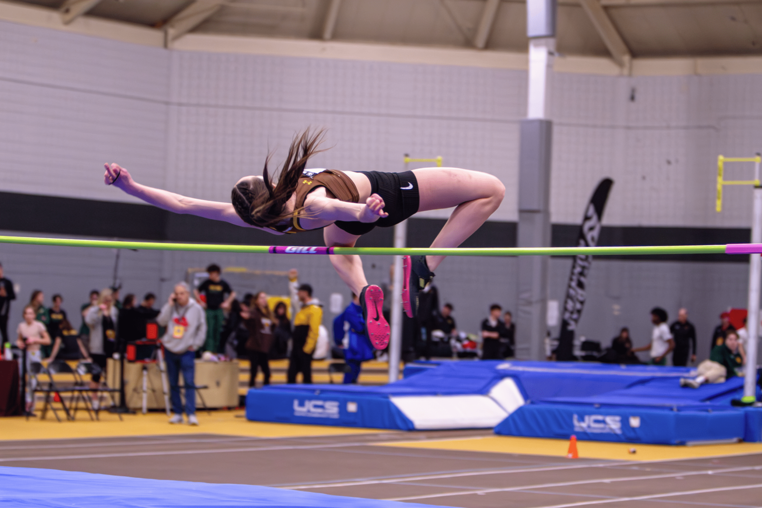 Lara Denbow soaring over the high jump bar
