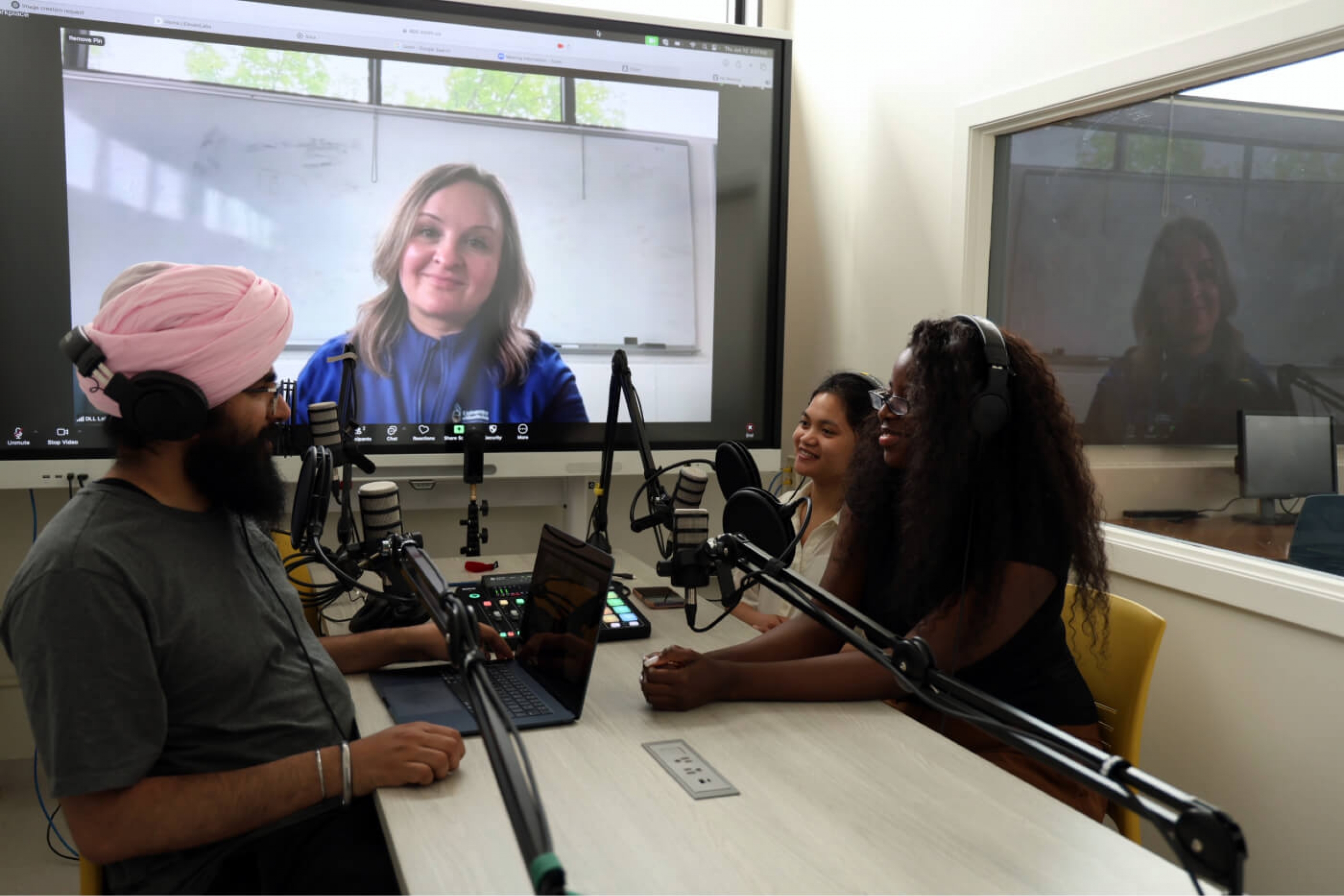 Students and staff recording a podcast in the Digital Literacies Lab.