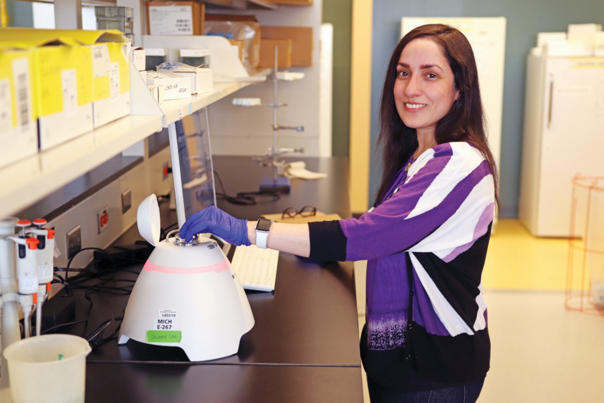 Dr. Ayesha Saleem uses an Exoid machine in her lab. 