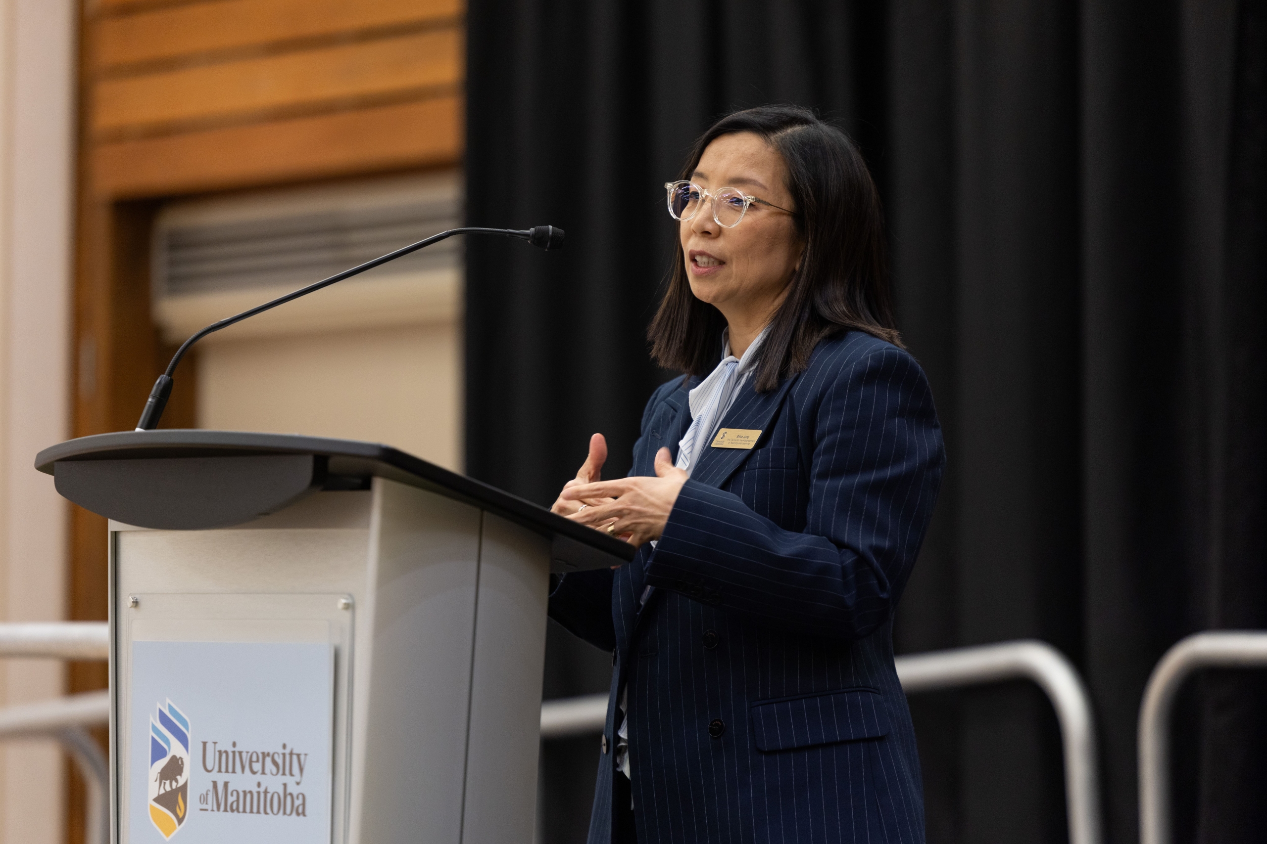 Dr. Erica Jung presents the introduction to the reception.