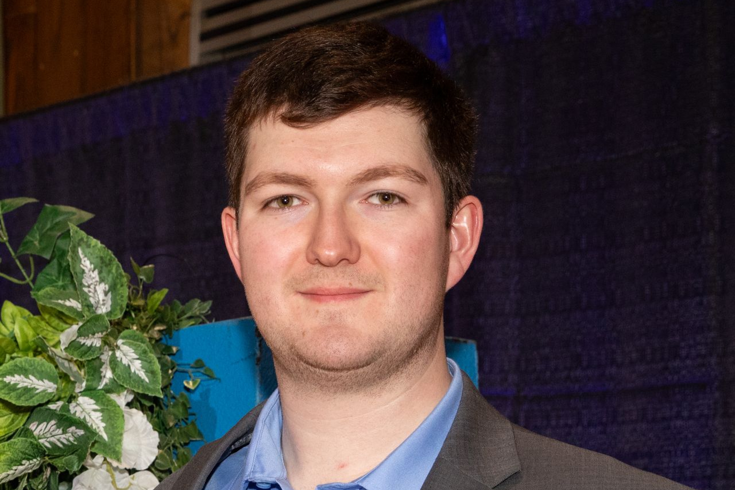 A person posing in formal wear