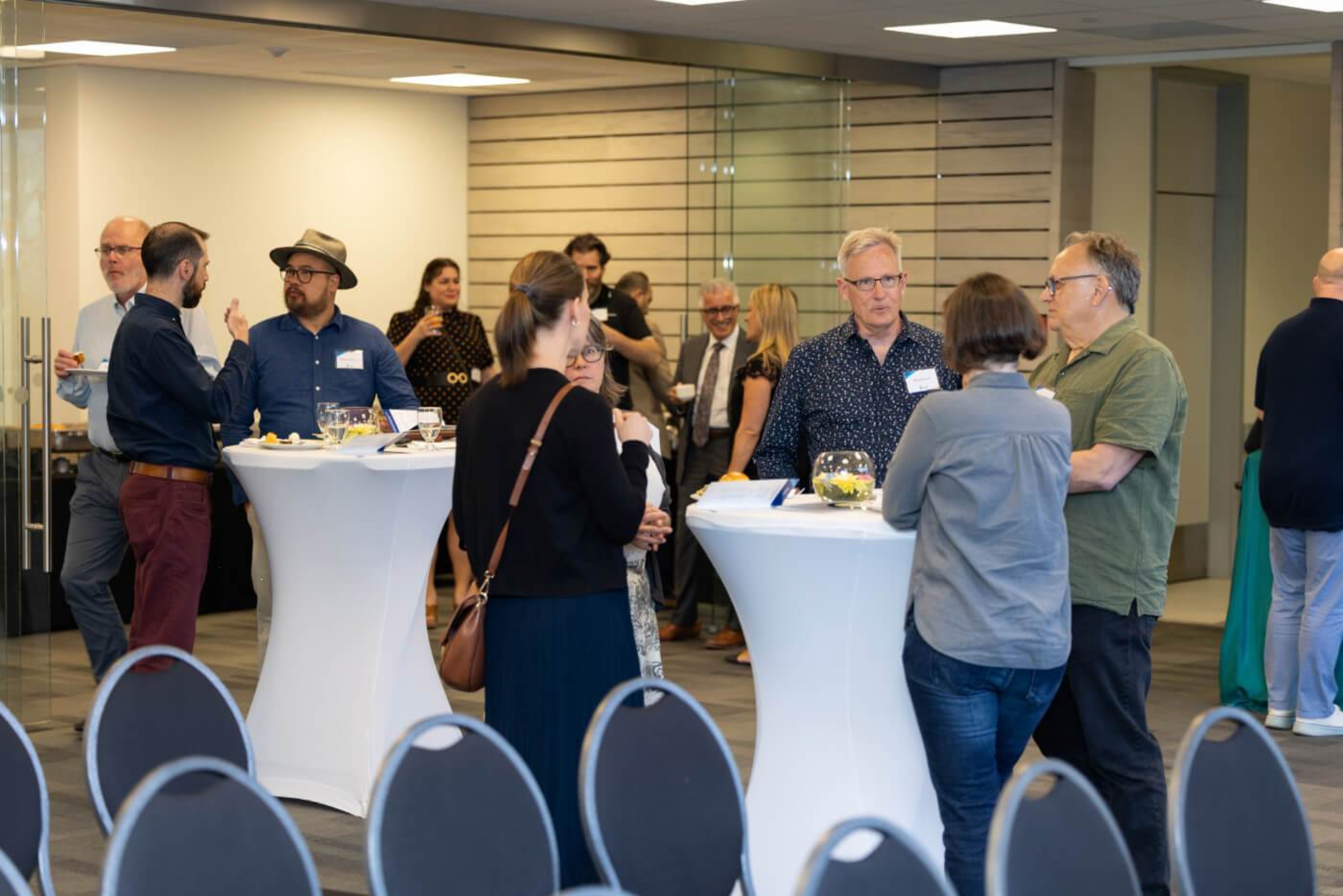 Attendees of the Faculty Recognition Reception mingle and share in refreshments.