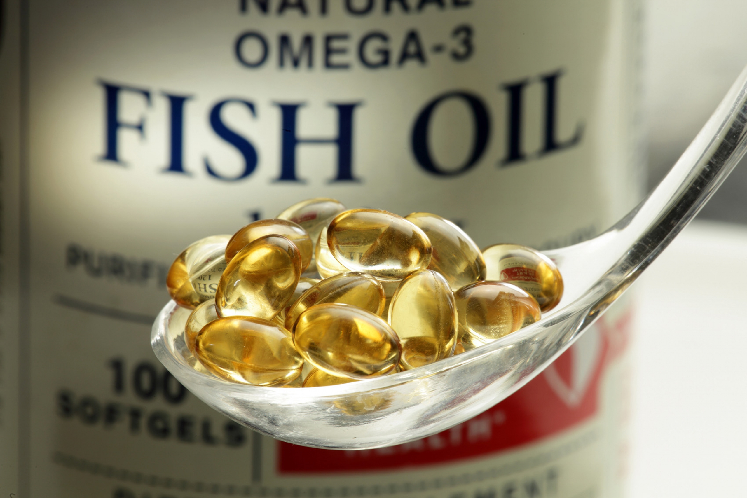 A spoon of fish oil supplements