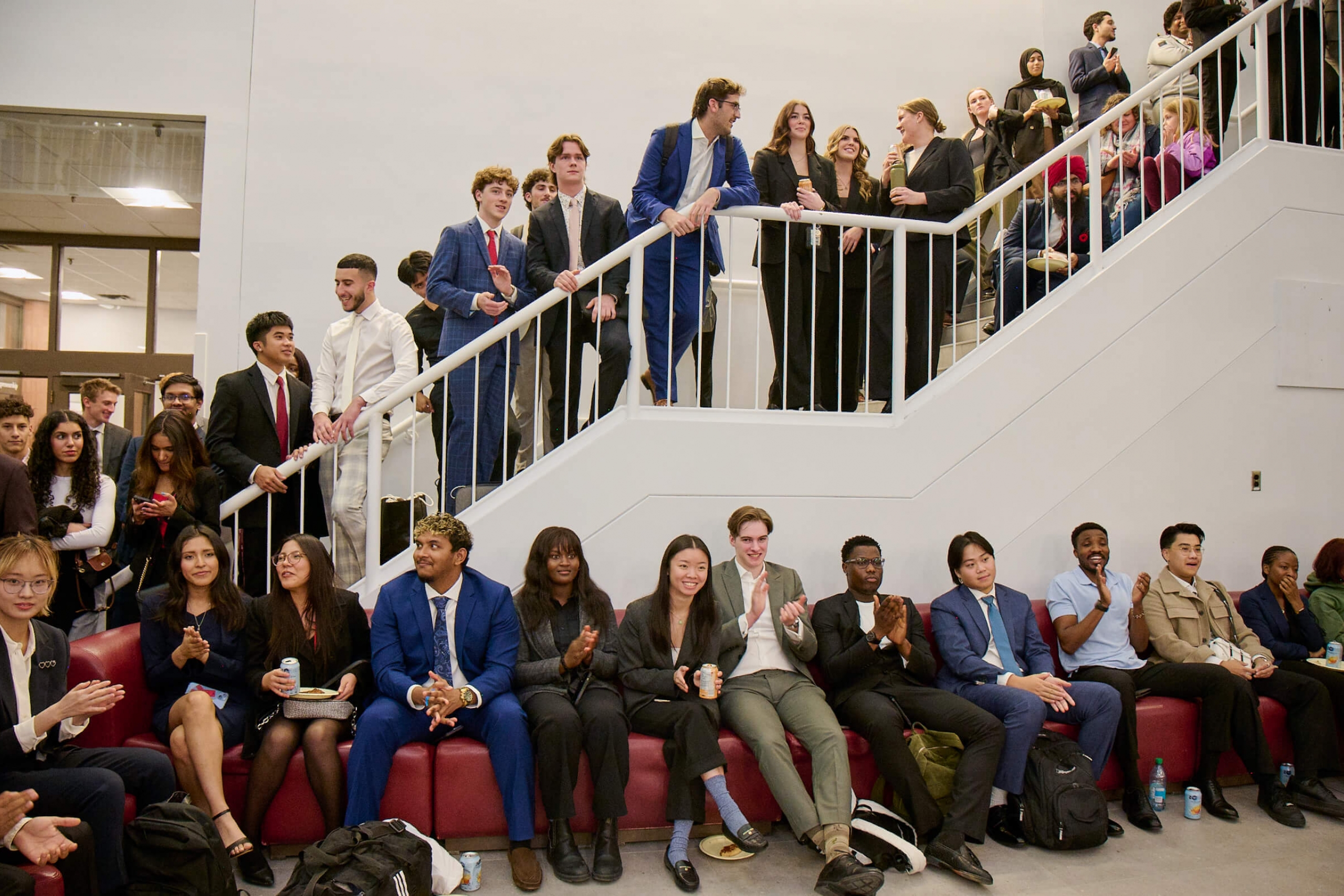 students fill the stairway and floor in front