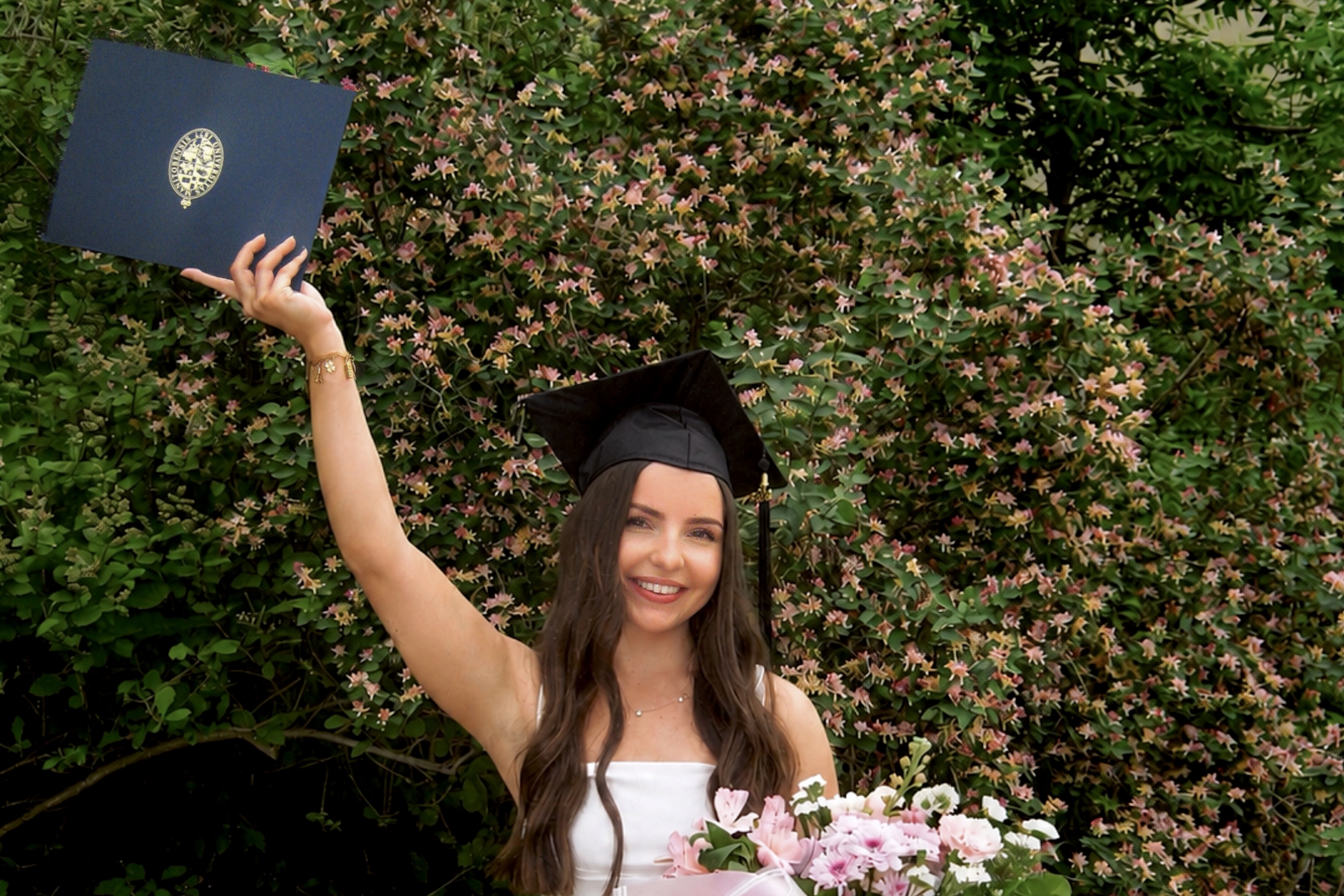 Taylor Bially wears a grad cap