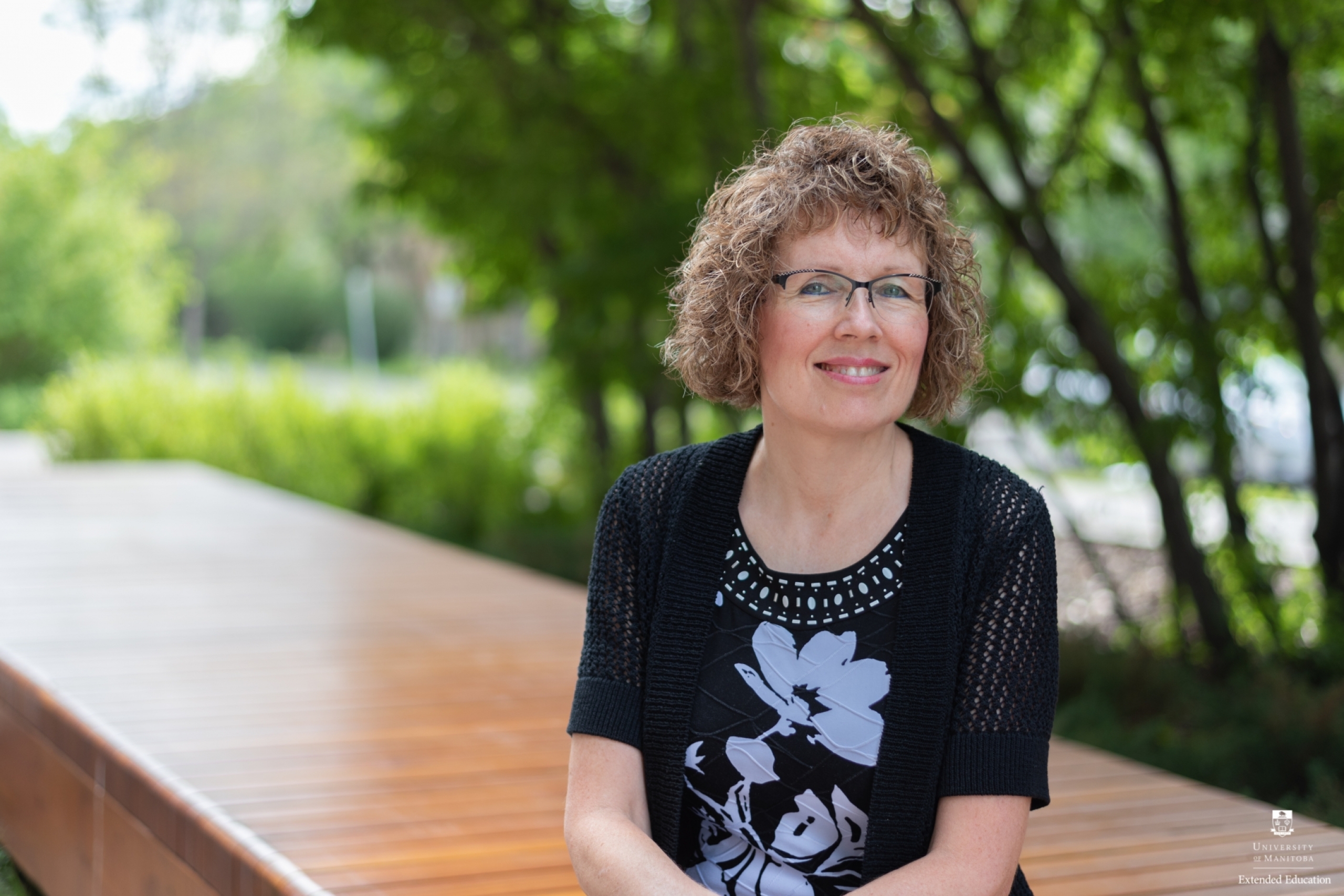 Woman seated outside on a summer day
