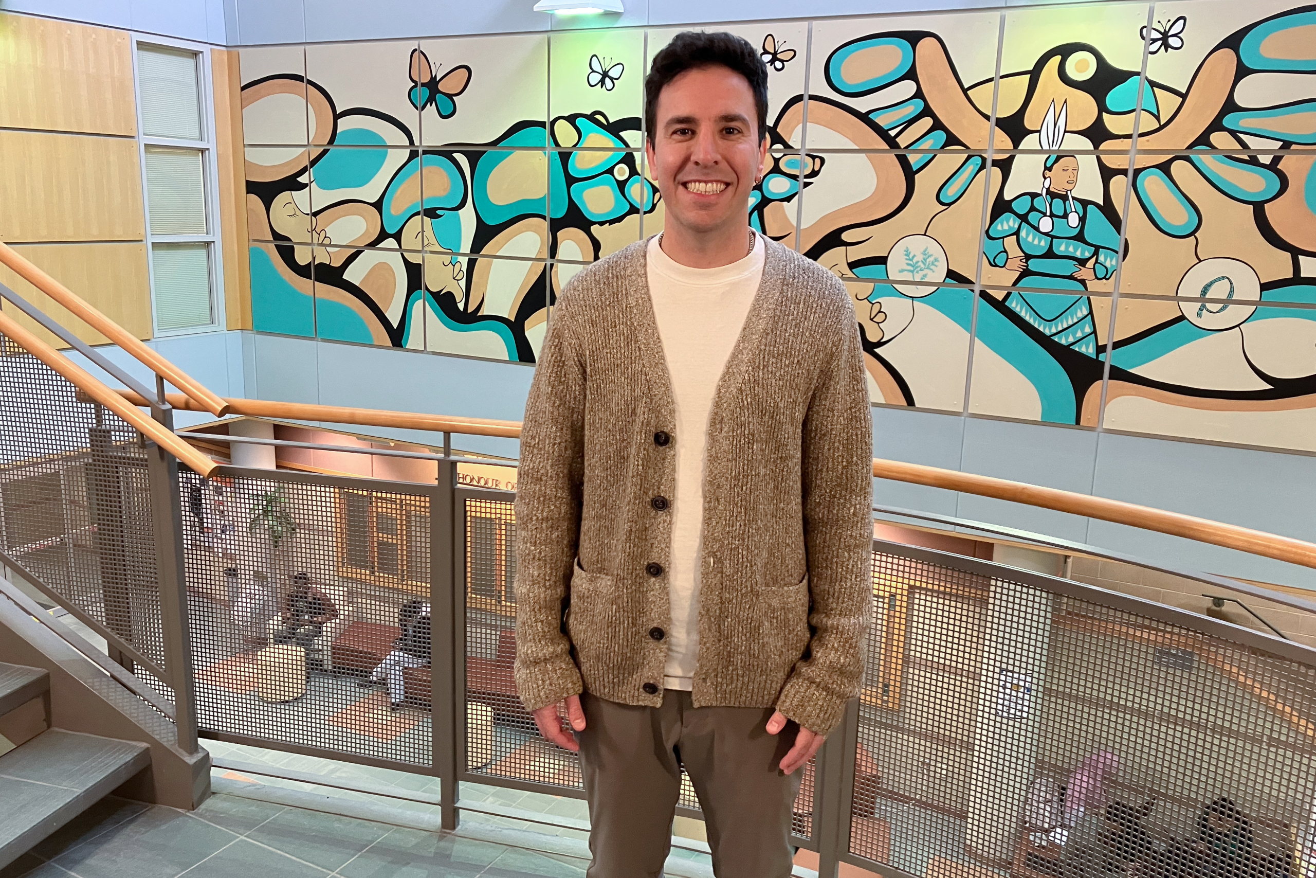 Man stands by the stairs