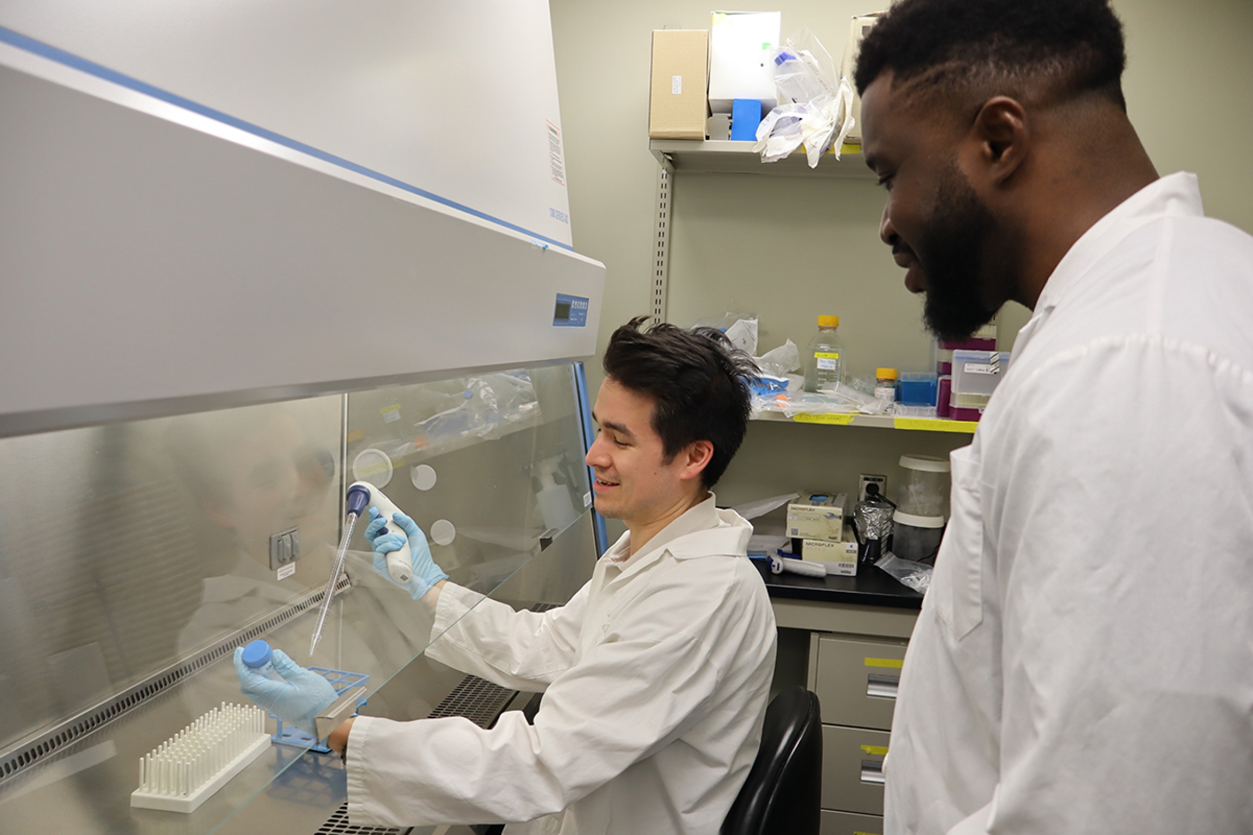 Two people working together in a lab.