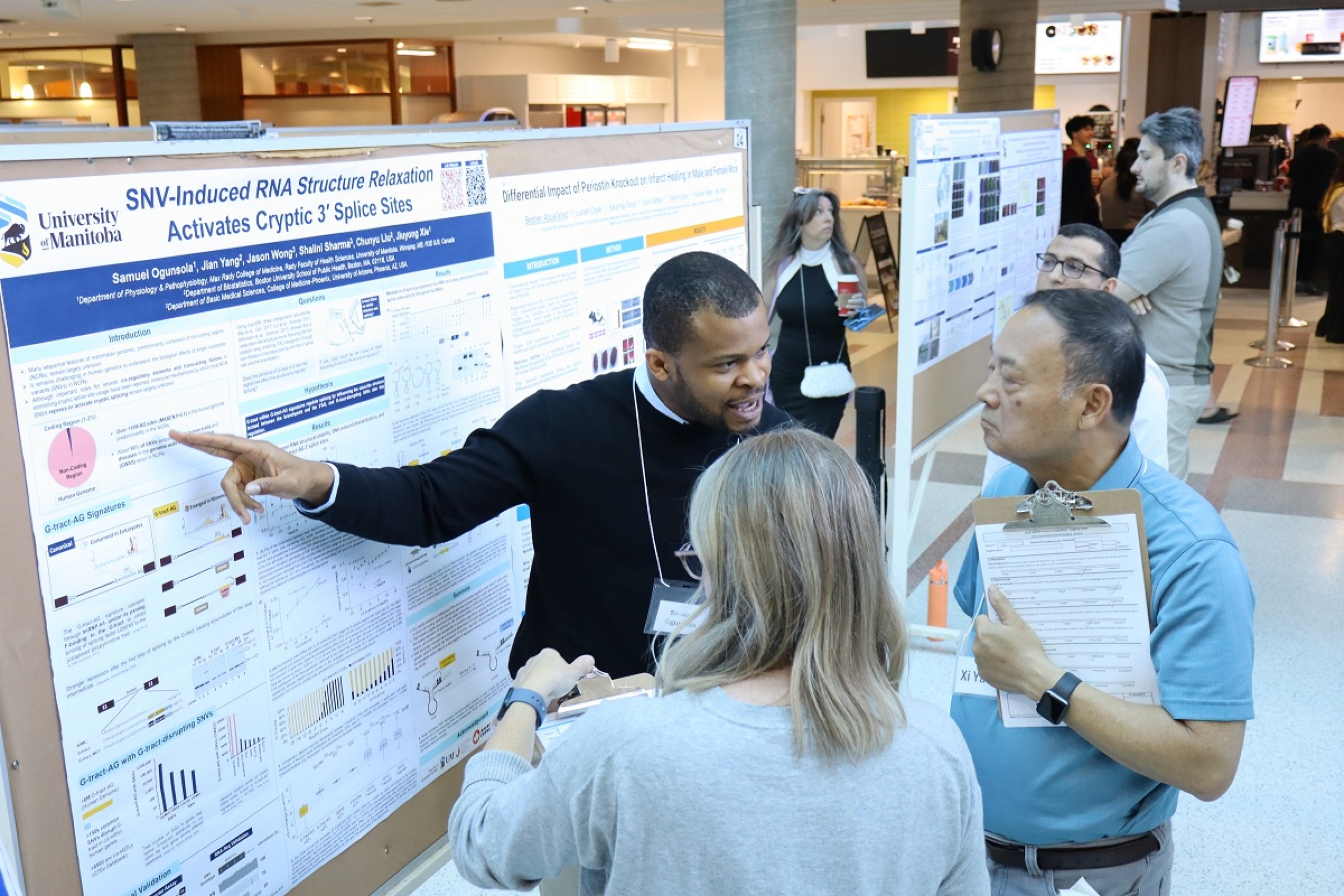 A student explains his research project to a group of judges.