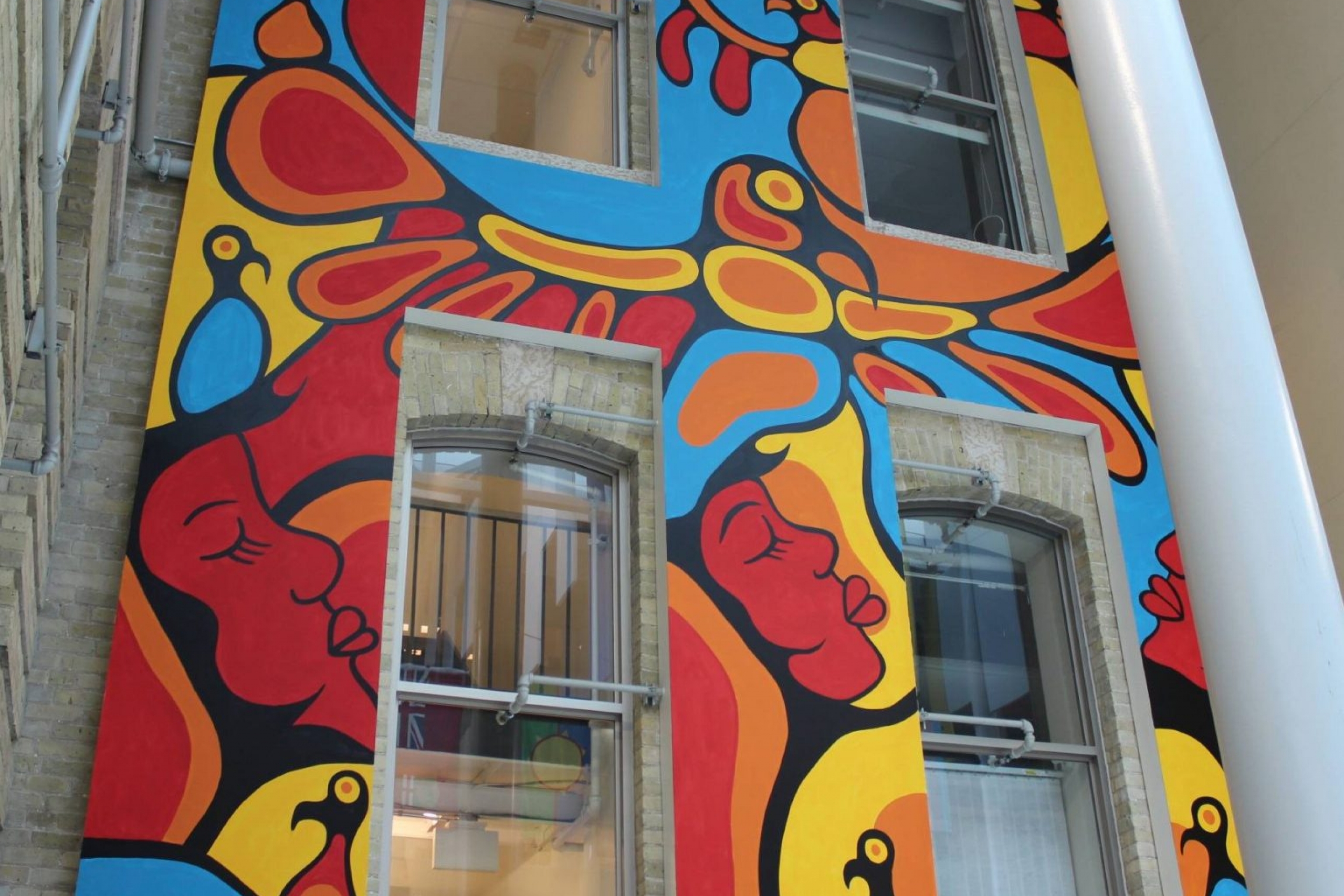 a colourful mural featuring red and orange thunderbirds