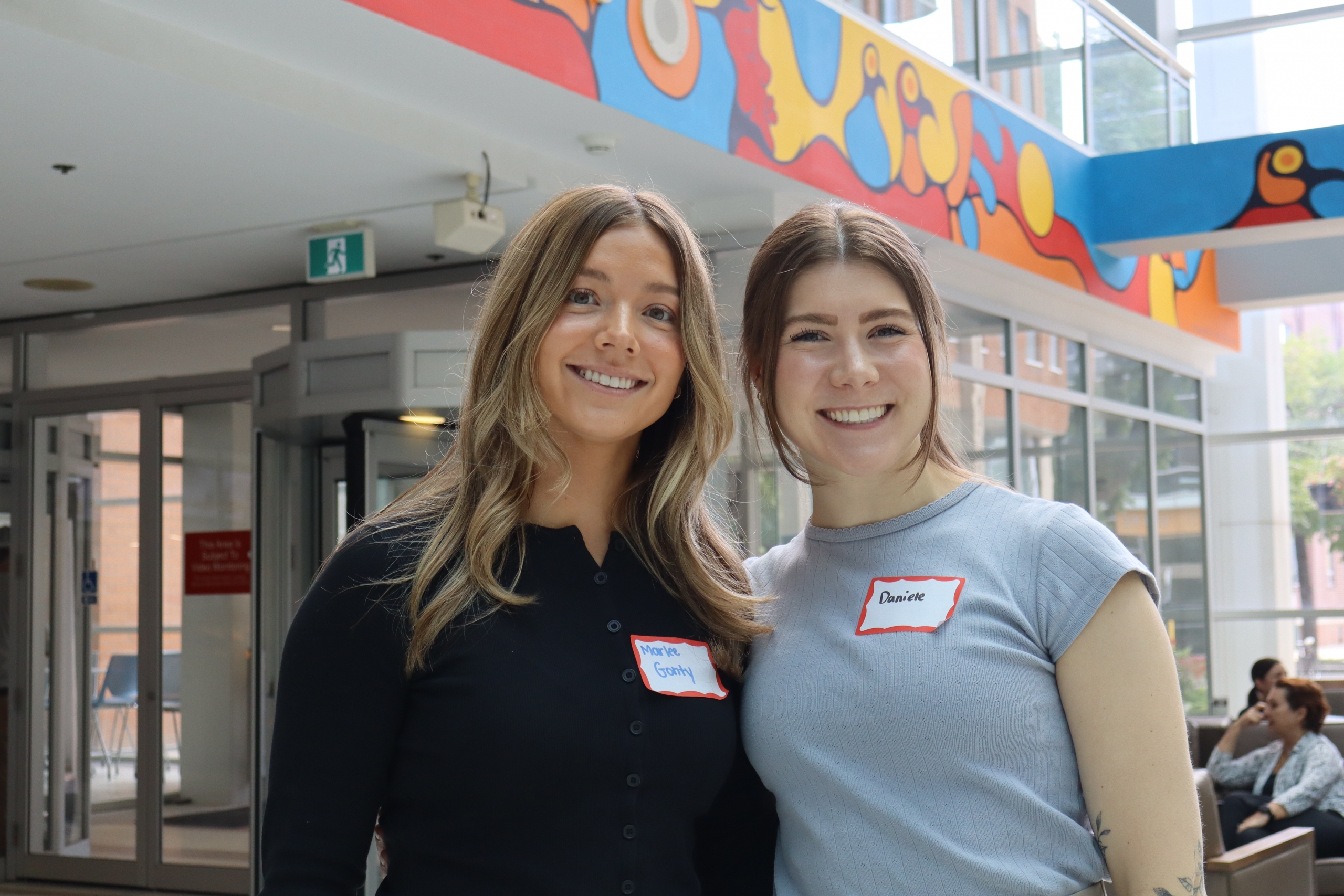 Marlee Gonty and Daniele Dyck in the Brodie atrium at Bannatyne campus.