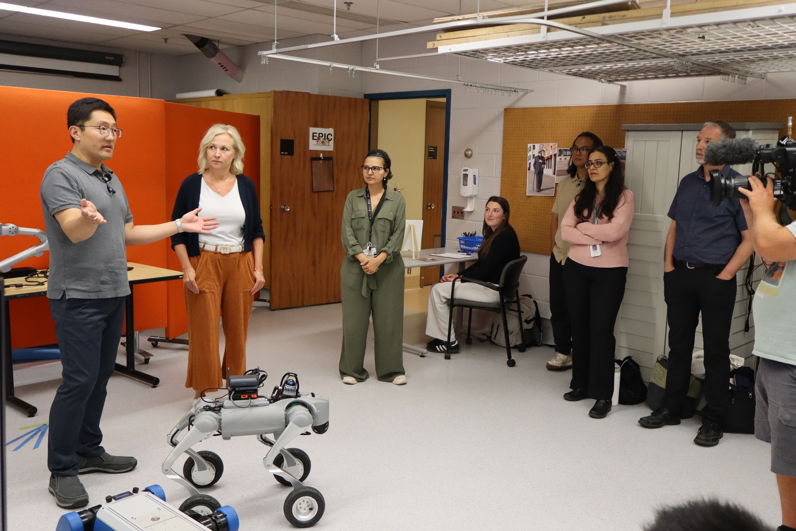 Dr. Jay Wang and Dr. Jacquie Ripat give a demonstration of the robot dogs.