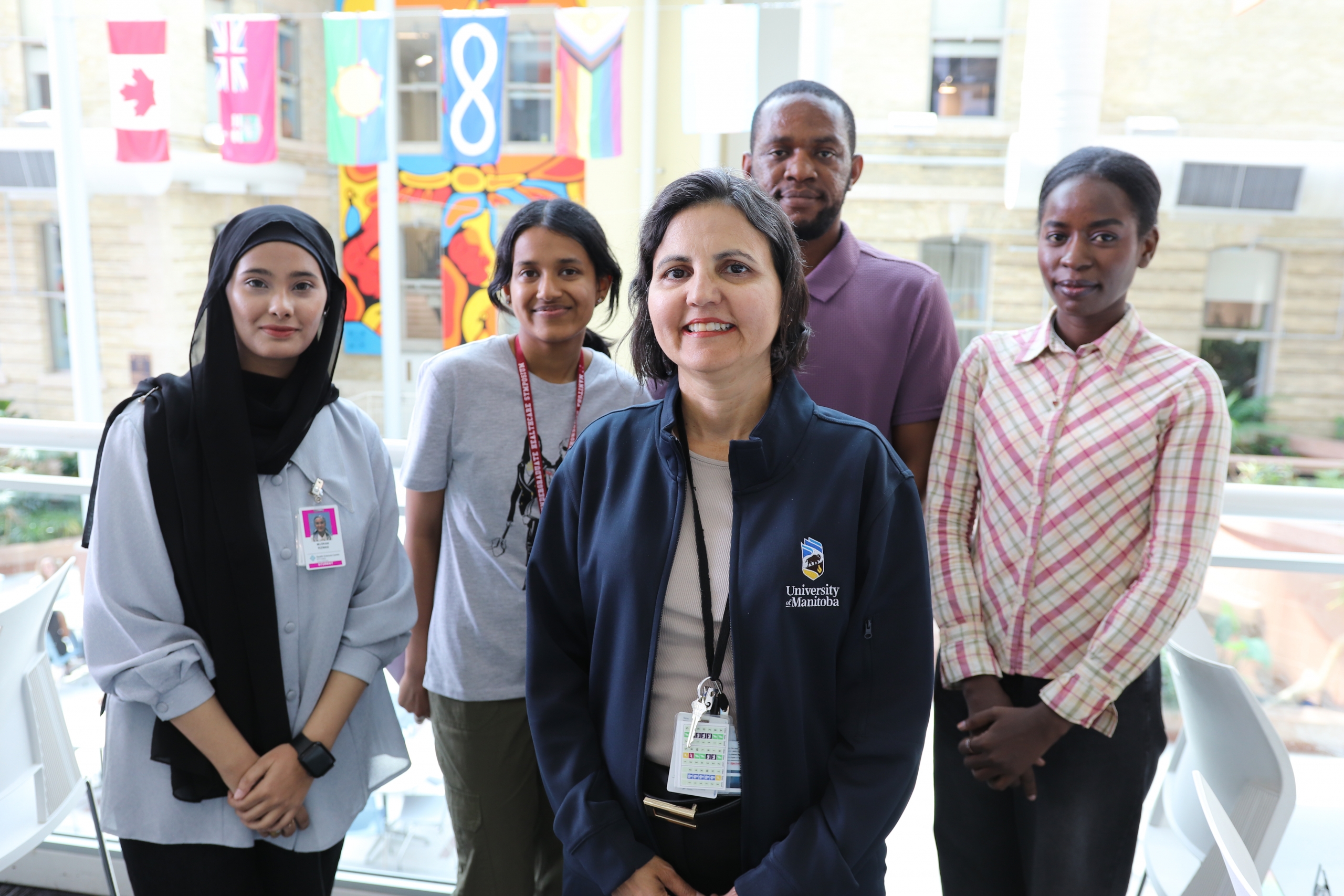 Dr. Mirella Veras and her research team in the Brodie atrium at Bannatyne campus.