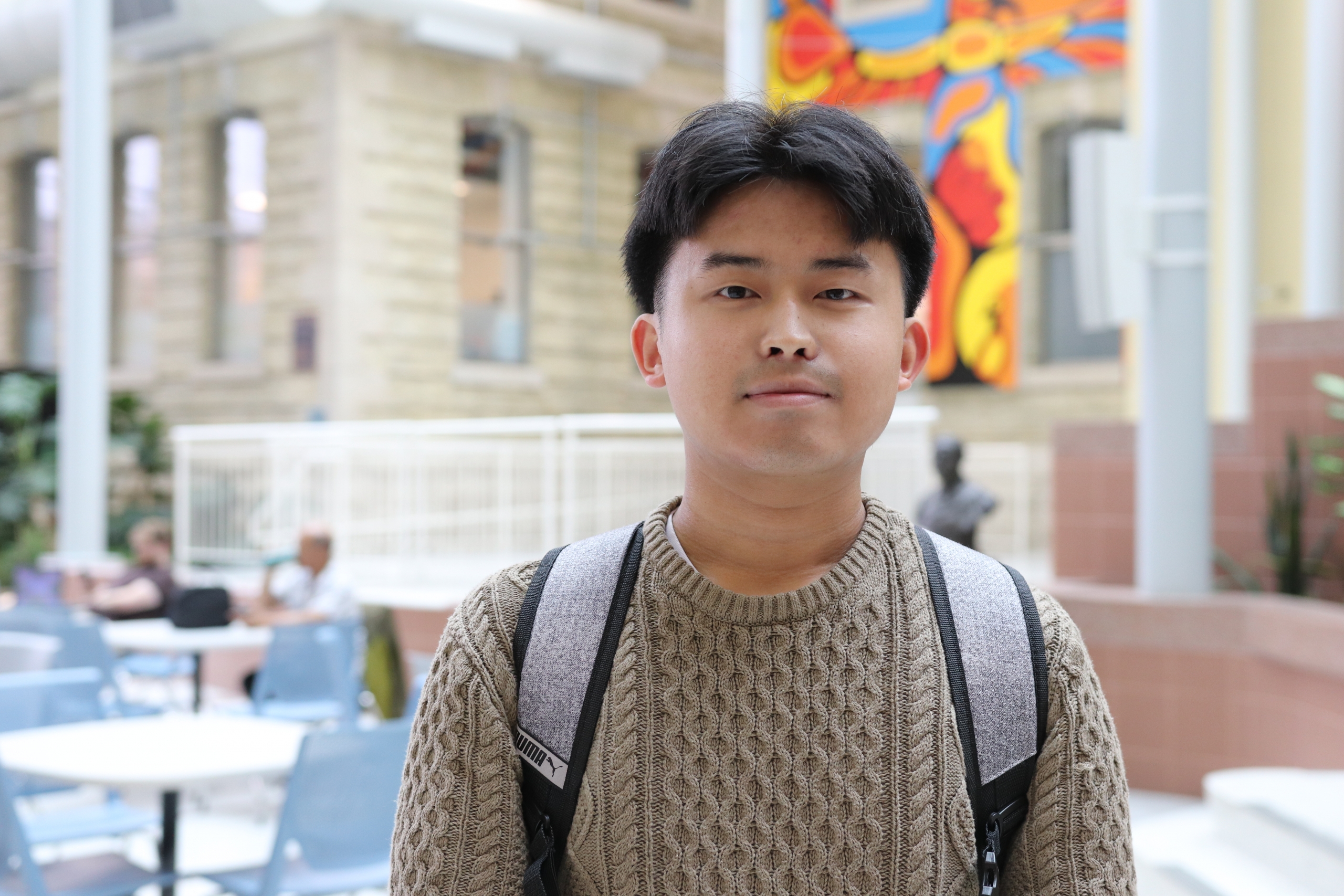 Christopher Luu in the Brodie atrium at Bannatyne campus.