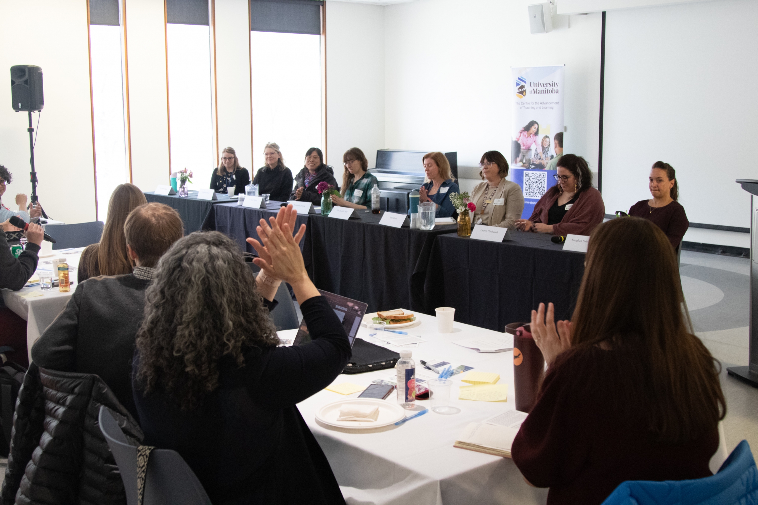 The audience applauding the various panelists after they provide a range of advice from their disciplines