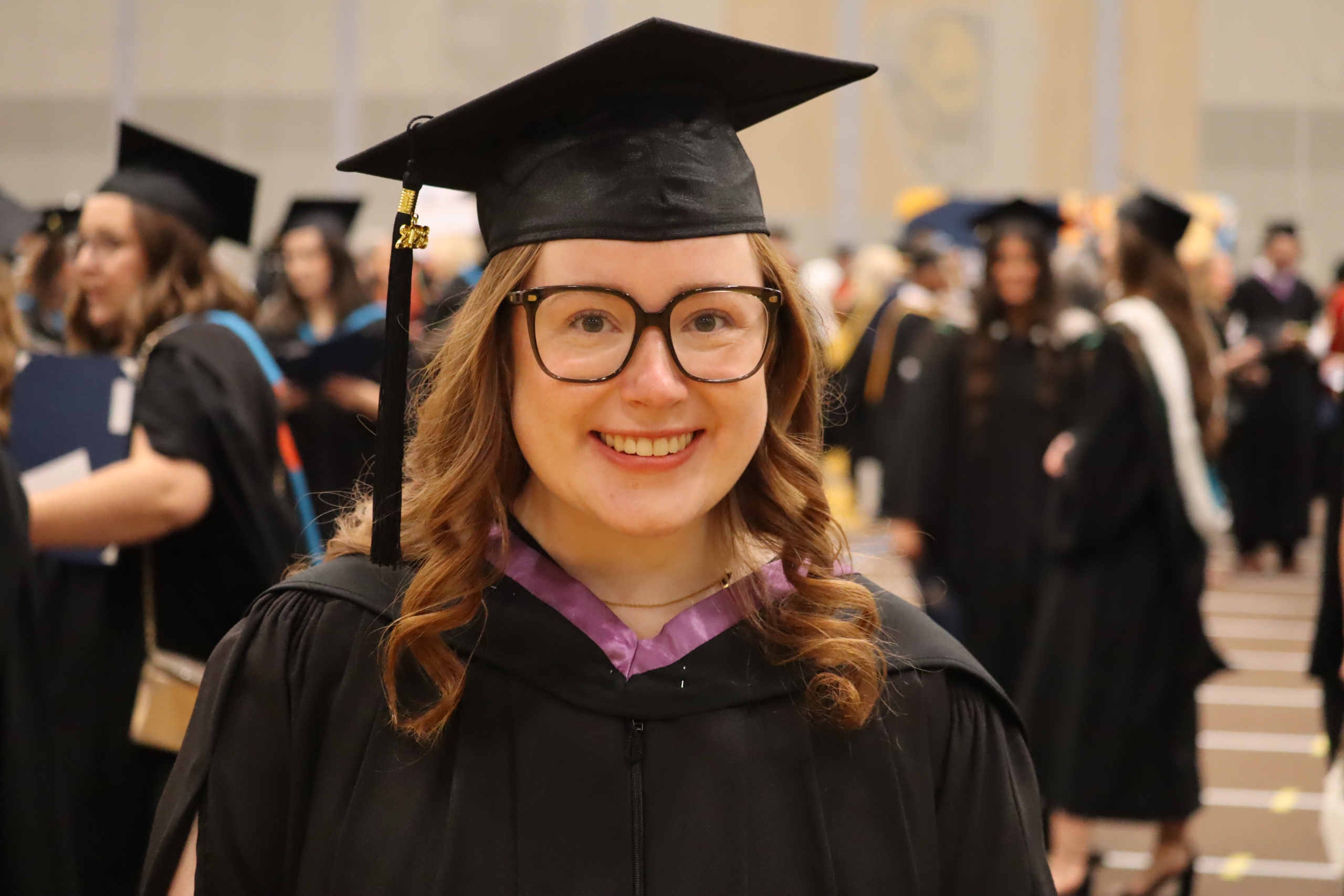 Mackenzie Alexiuk in her cap and gown at convocation.