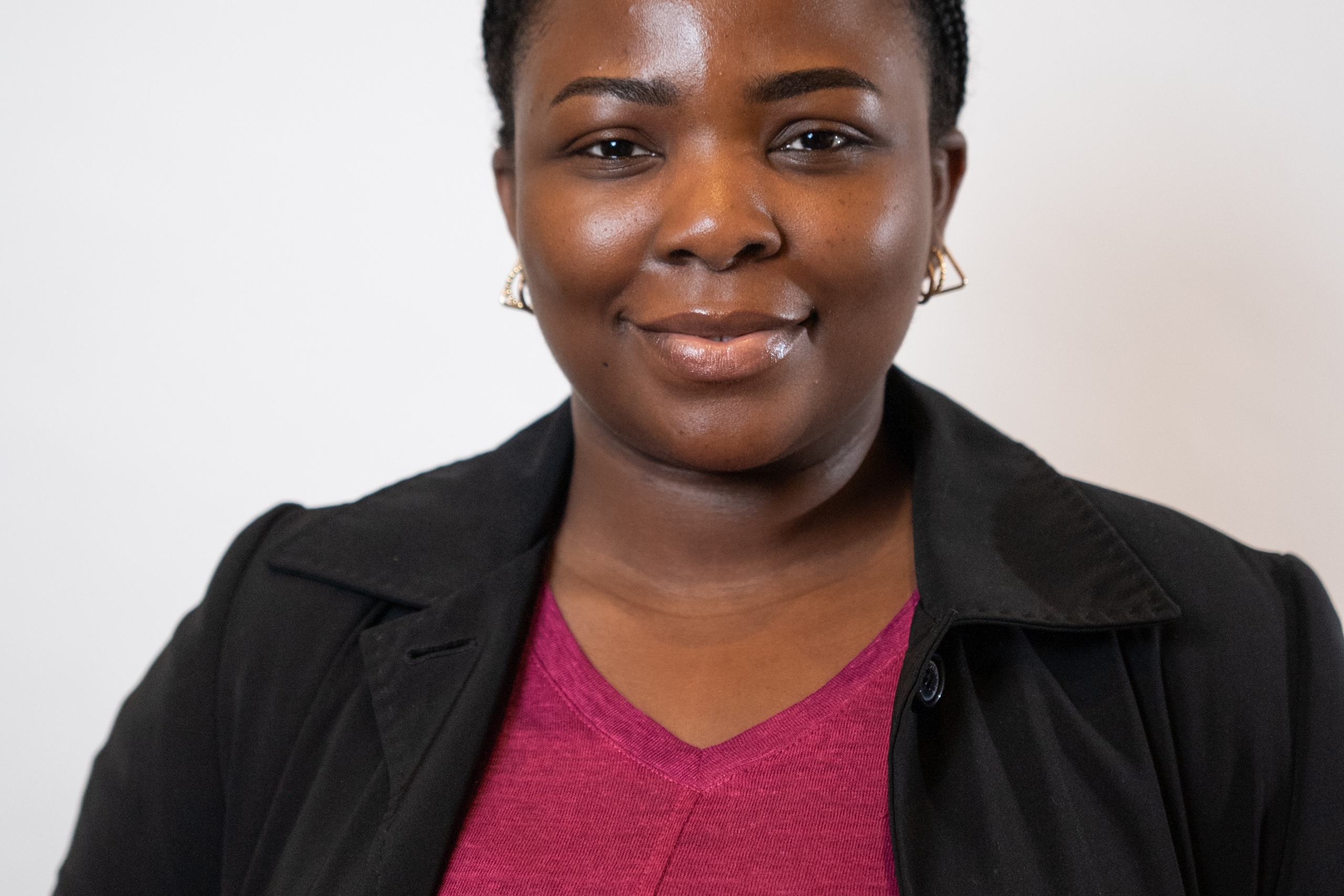 Woman in pink shirt with black jacket