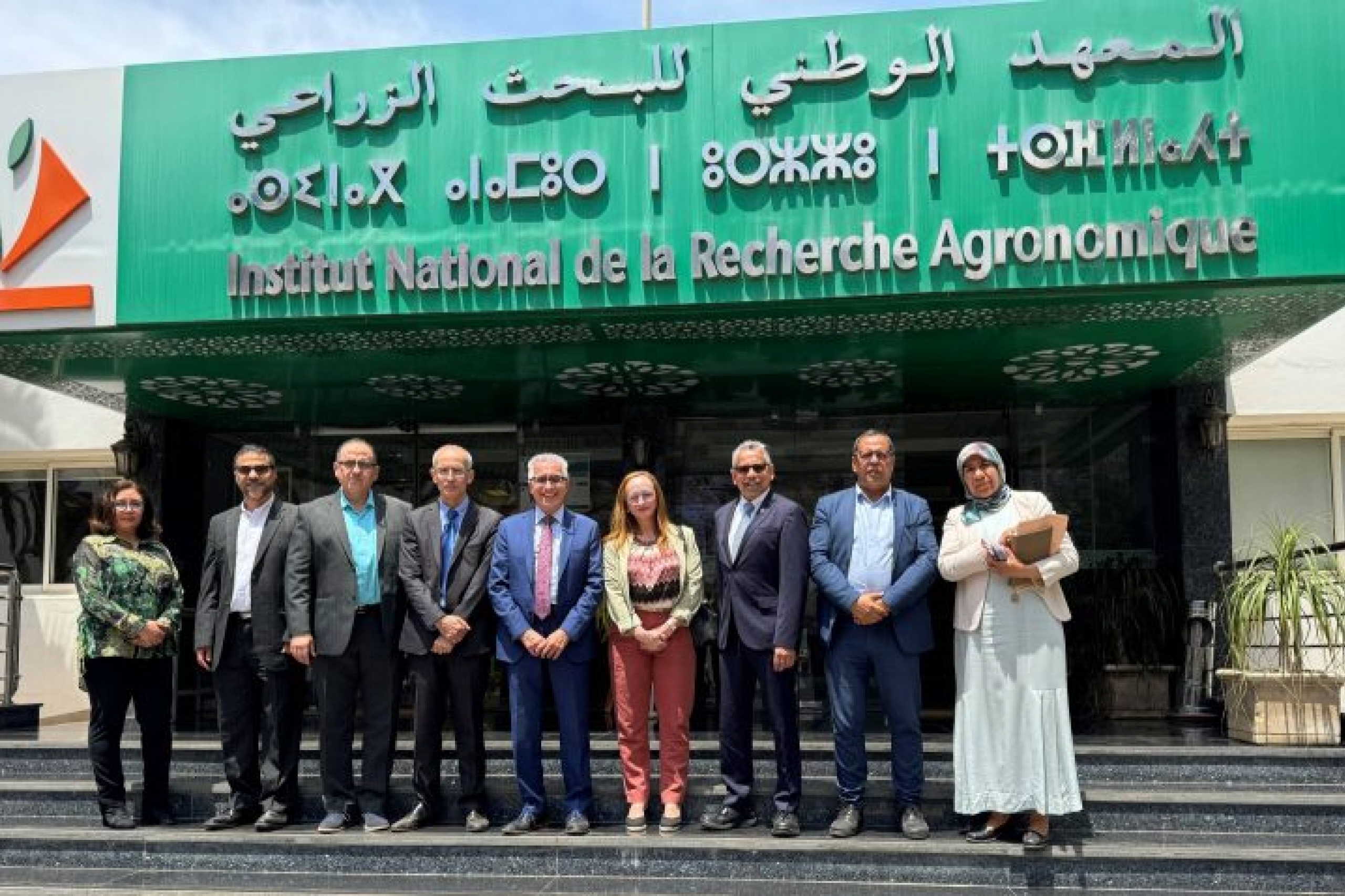 group at entrance to a building