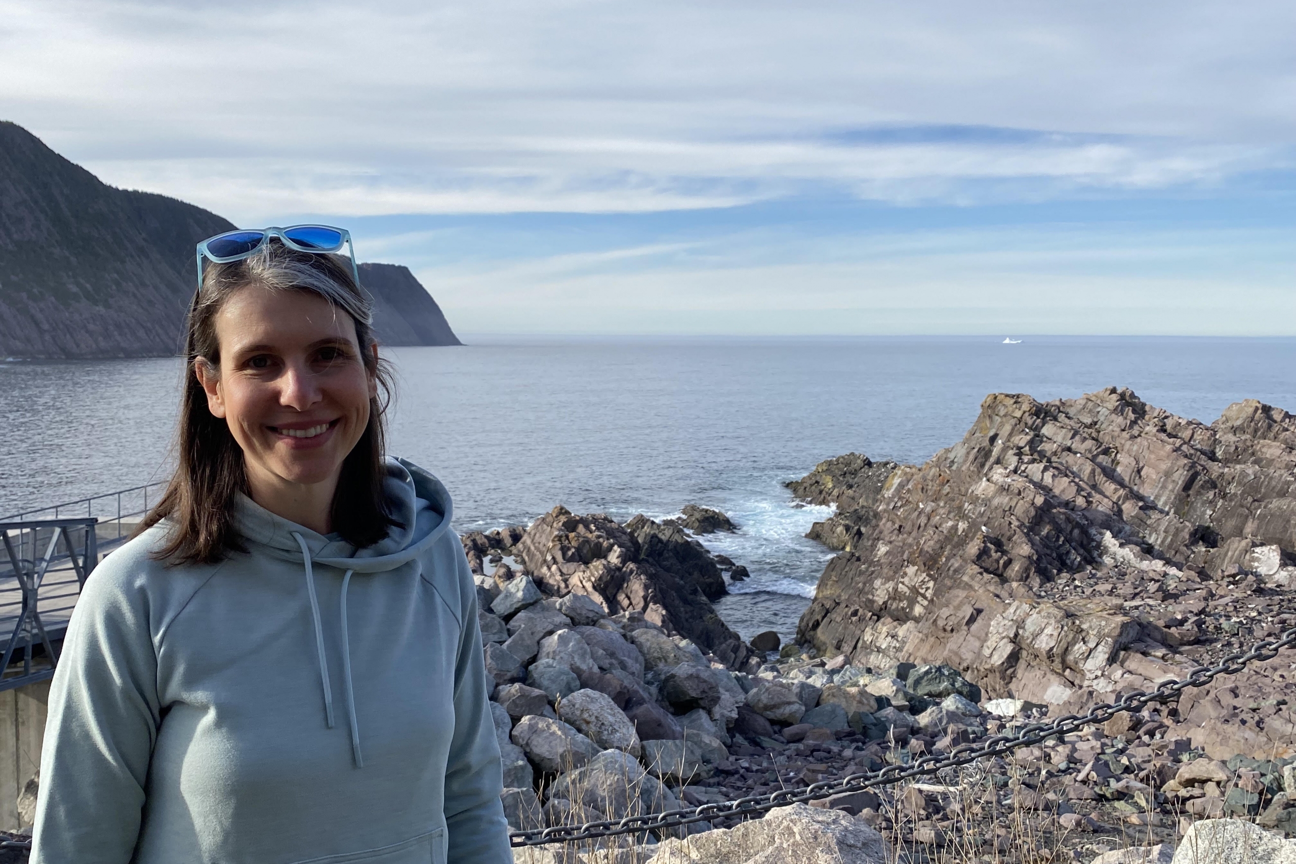 Dr. Marson is posing for a photo on the coast of cold waters.