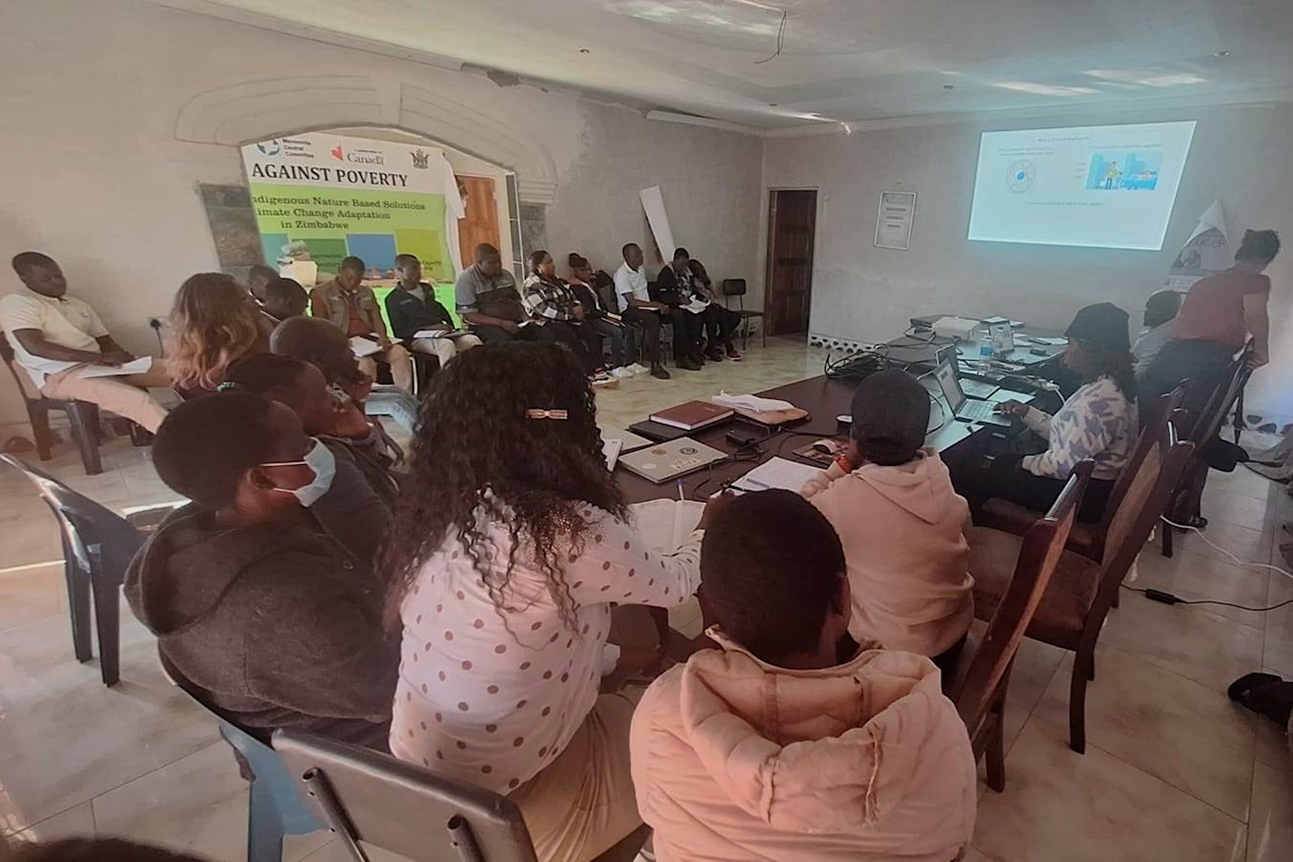 People sit around a table at a workshop given by Janet Olanrewaju.