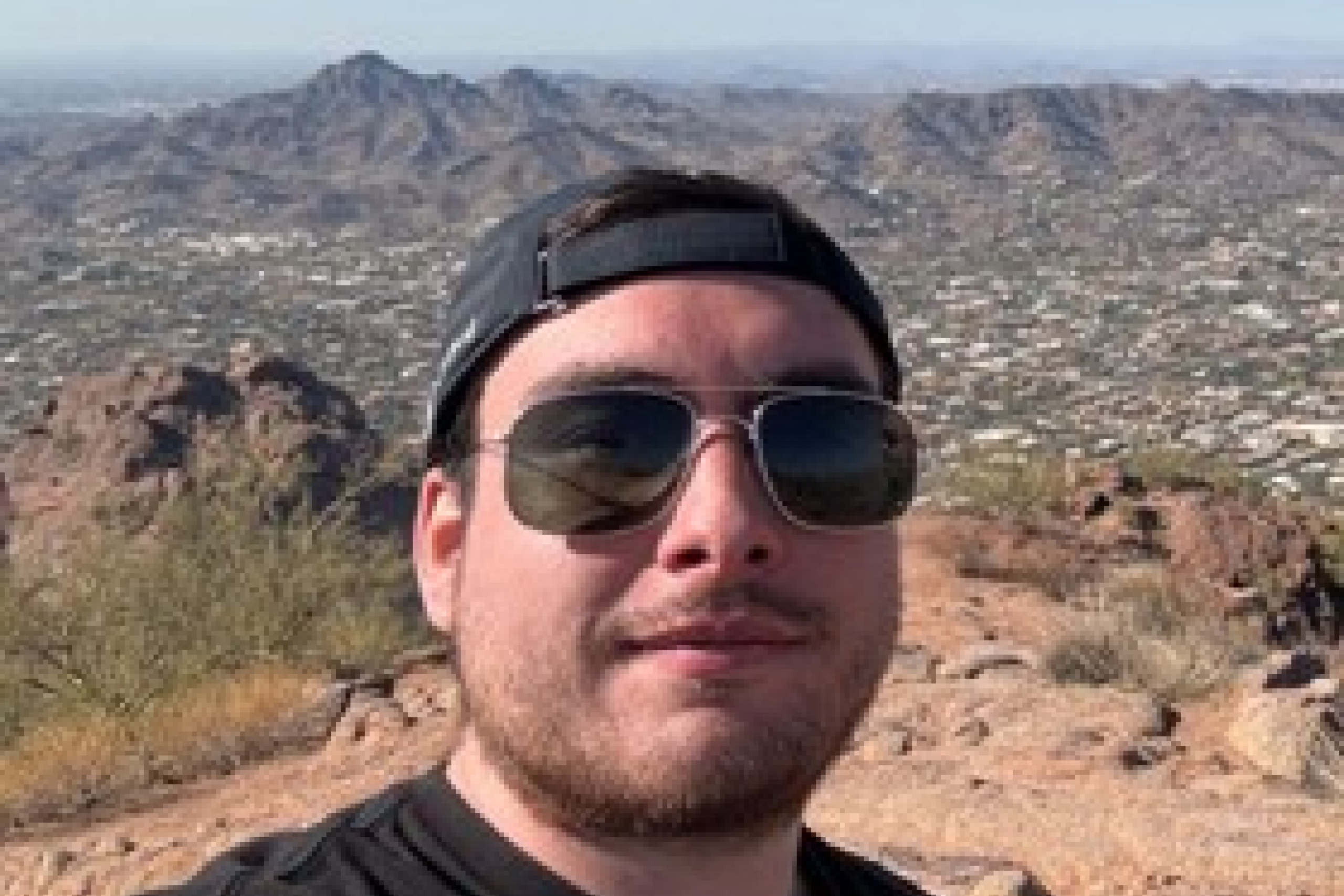 A person in sunglasses outside