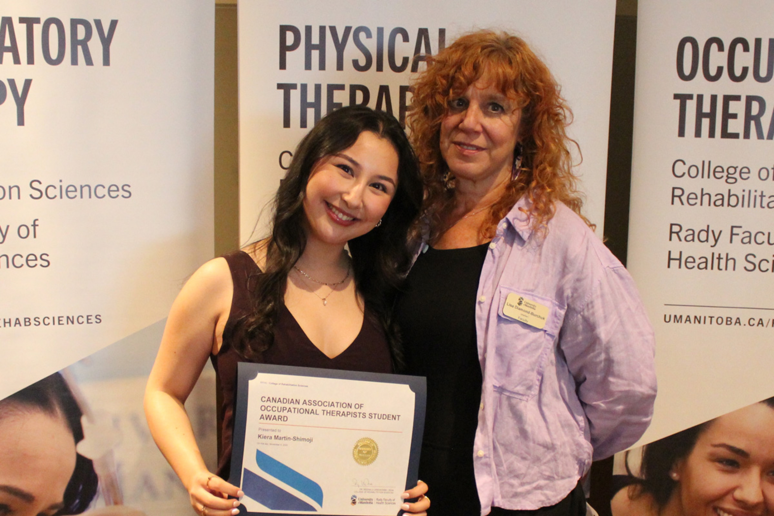 Kiera Martin-Shimoji poses with an award alongside instructor Lisa Diamond-Burchuk.