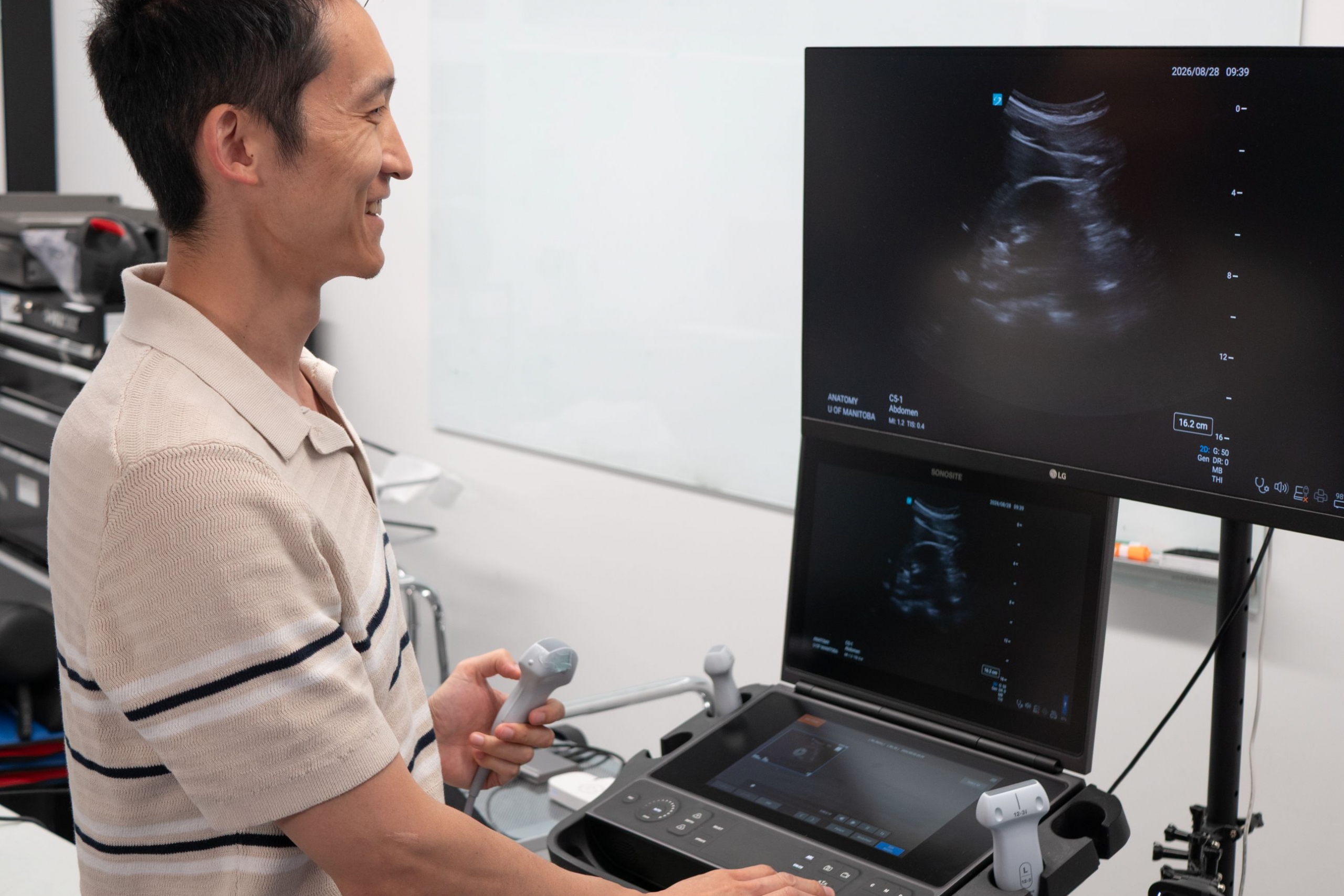 Terry Li views ultrasound images on monitor.