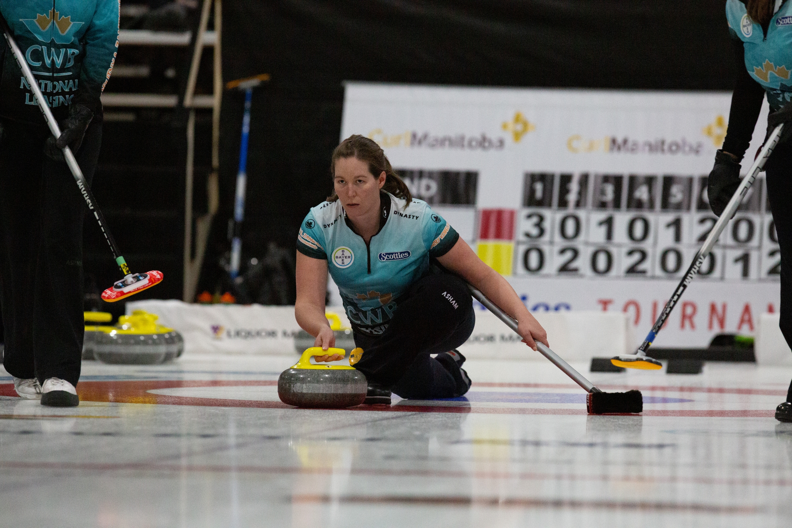 Lisa Bartley curling in a tournament.