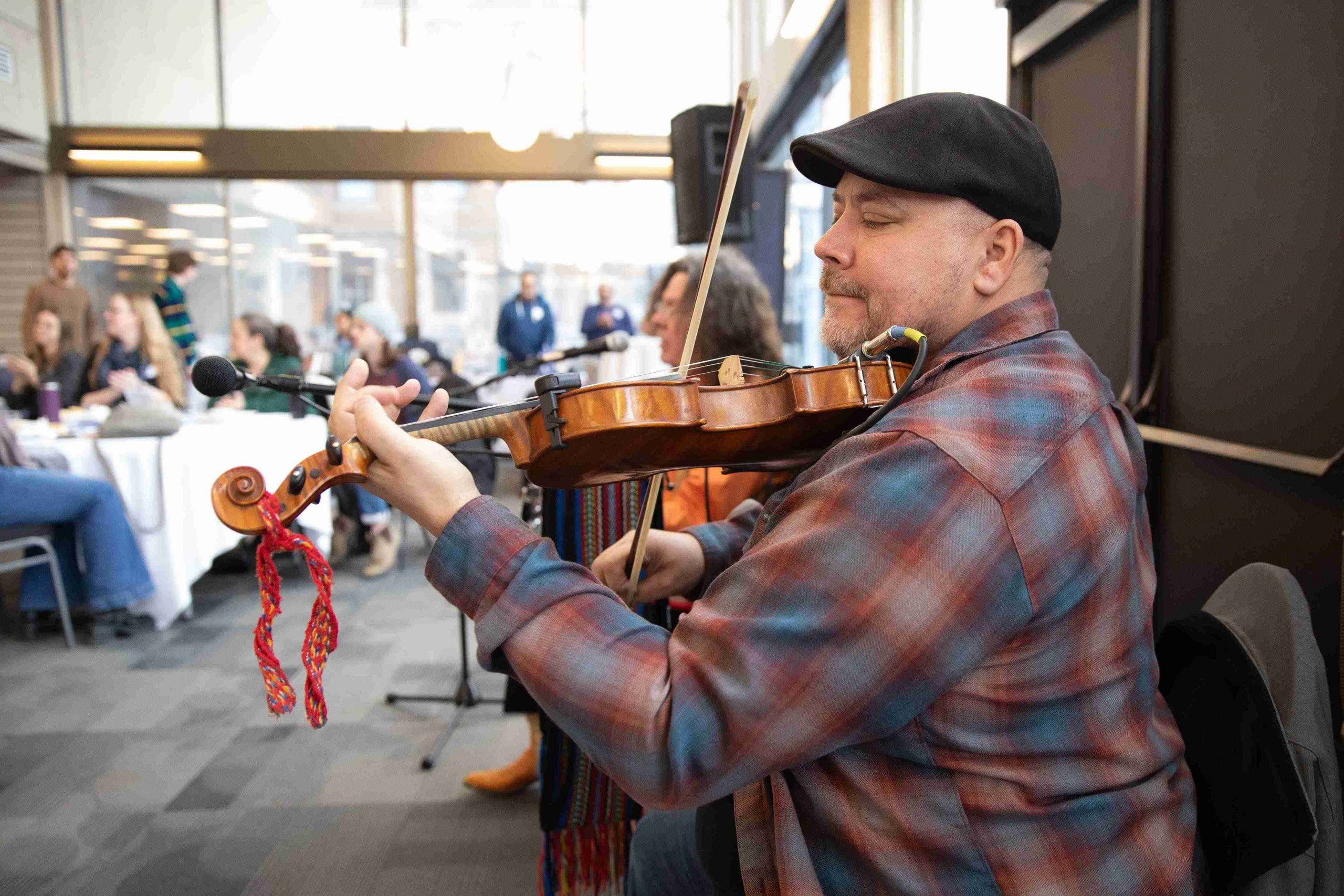 man playing fiddle 
